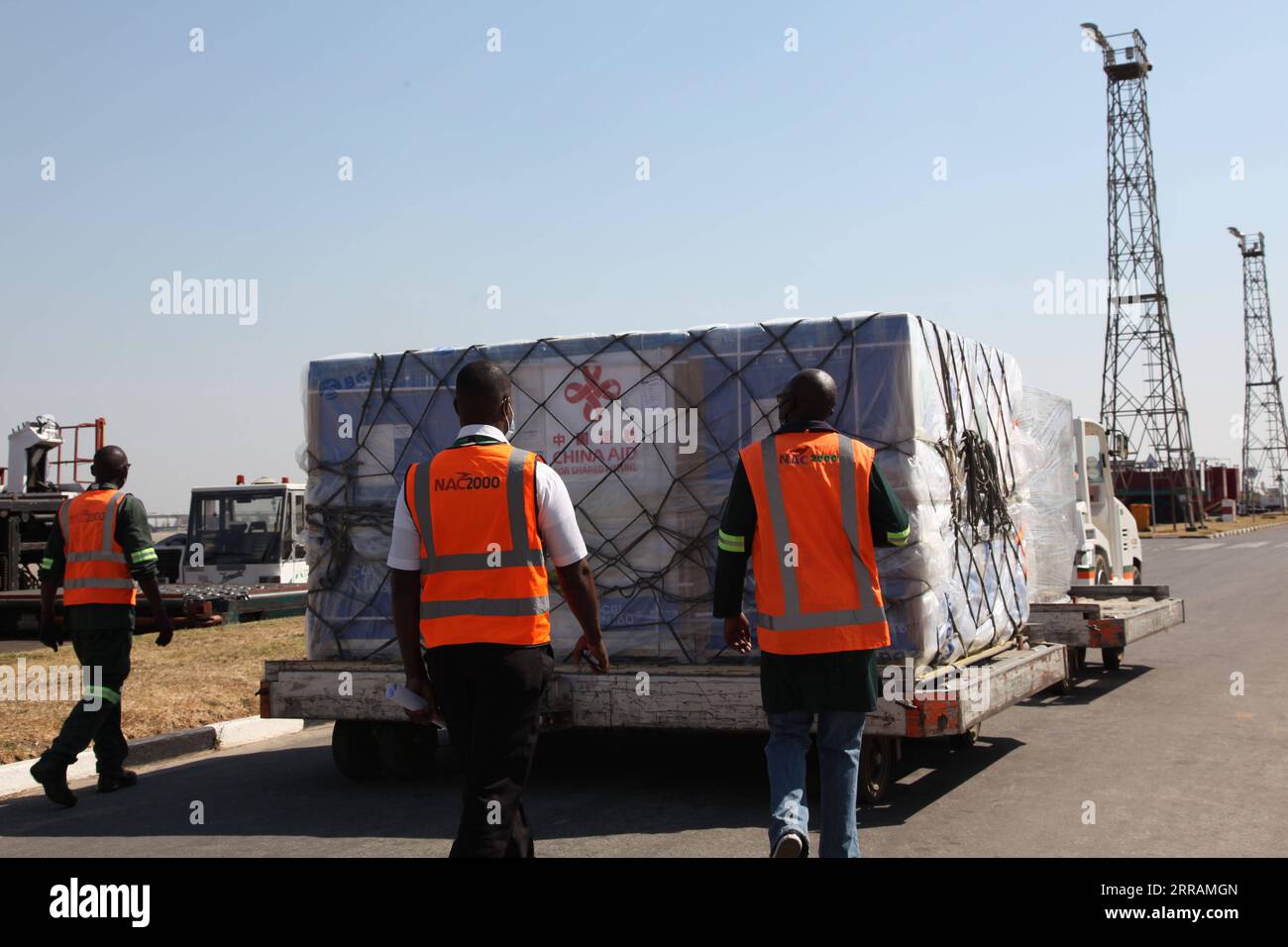 210807 -- LUSAKA, Aug. 7, 2021 -- Workers transfer a batch of China s Sinopharm vaccines at the Kenneth Kaunda International Airport in Lusaka, Zambia, on Aug. 7, 2021. A batch of China s Sinopharm vaccines arrived in Zambia on Saturday to be part of the southern African nation s basket of COVID-19 vaccines.  ZAMBIA-LUSAKA-CHINA-COVID-19 VACCINES-ARRIVAL ZhaoxYupeng PUBLICATIONxNOTxINxCHN Stock Photo