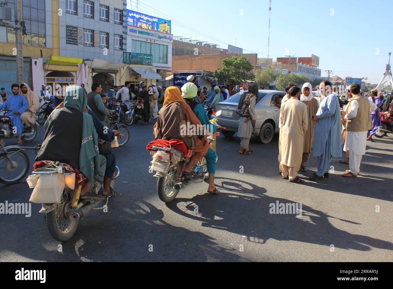 210814 -- HERAT, Aug. 14, 2021 -- Taliban militants are seen in Herat province, Afghanistan, Aug. 13, 2021. The Afghan Taliban said their members overran three more provincial capitals on Friday, after they have taken control over a dozen cities within a week. Zabihullah Mujahid, a Taliban spokesman, wrote on his social media account that they captured Tirin Kot, capital of southern Uruzgan province, and Firoz Koah, capital of western Ghor province. AFGHANISTAN-HERAT-TALIBAN-CONTROL OVER-THREE MORE PROVINCIAL CENTERS STR PUBLICATIONxNOTxINxCHN Stock Photo