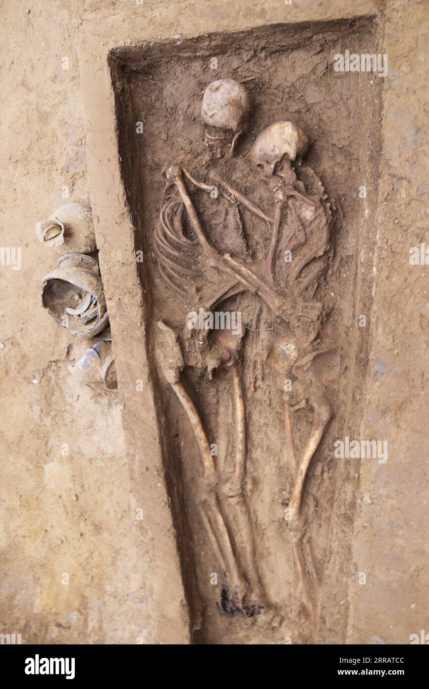 210816 -- CHANGCHUN, Aug. 16, 2021  -- Photo taken on Aug. 5, 2020 shows the tomb of lovers hugging each other dating back to the Northern Wei Dynasty 386-534 unearthed in Datong City, north China s Shanxi Province. Archaeologists have recently published studies on a tomb of lovers hugging each other dating back to the Northern Wei Dynasty 386-534 more than 1,600 years ago, according to Jilin University. The tomb was first excavated in Datong City, north China s Shanxi Province, in 2020. The couple lay in a single coffin buried in the same grave. The male had his arms wrapped around his lover Stock Photo