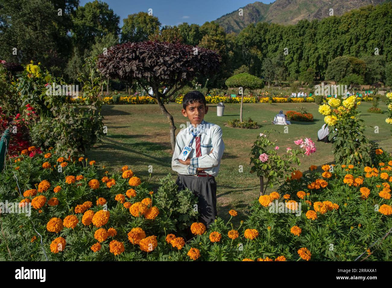 Srinagar, India. 06th Sep, 2023. A school boy poses for photos in the Nishat garden, the second largest terraced Mughal garden in the valley built on the banks of world famed Dal lake in Srinagar. Lieutenant Governor said nearly 12 million tourists have visited Jammu and Kashmir in the first seven months of 2023 and the figure is expected to cross 20 million by the end of the year. (Photo by Faisal Bashir/SOPA Images/Sipa USA) Credit: Sipa USA/Alamy Live News Stock Photo