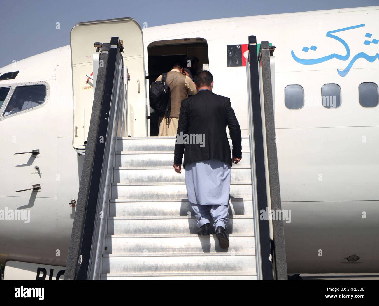 210906 -- KABUL, Sept. 6, 2021 -- Passengers board a plane at the airport in Kabul, capital of Afghanistan, Sept. 6, 2021. Afghanistan s flag carrier airline Ariana Afghan Airlines has resumed domestic flights, a local television channel reported Sunday. Photo by /Xinhua AFGHANISTAN-KABUL-AIRLINE-DOMESTIC FLIGHTS SaifurahmanxSafi PUBLICATIONxNOTxINxCHN Stock Photo