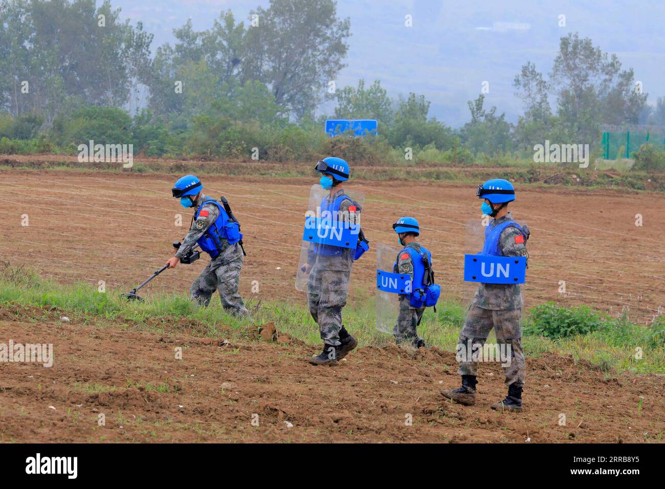 210908 -- ZHENGZHOU, Sept. 8, 2021 -- Peacekeepers participate in an international peacekeeping drill at a combined-arms tactical training base of the Chinese People s Liberation Army PLA in central China s Henan Province, Sept. 7, 2021. China started holding an international peacekeeping drill code-named Shared Destiny-2021 on Sept. 6. Drills of battlefield reconnaissance, security guarding and patrol, armed escort, protection of civilians, response to violent and terrorist attacks, construction of temporary operation base, battlefield first aid, and pandemic control are expected to be conduc Stock Photo