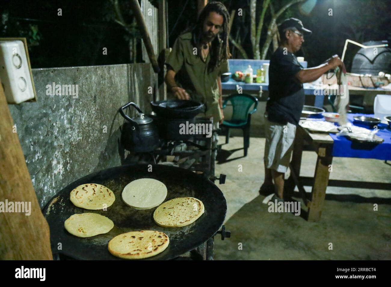 BriBri, Limon province, Costa Rica - March 17, 2016:  a man from BriBri culture preparing the tortilla with the old original ingredients of the ancest Stock Photo