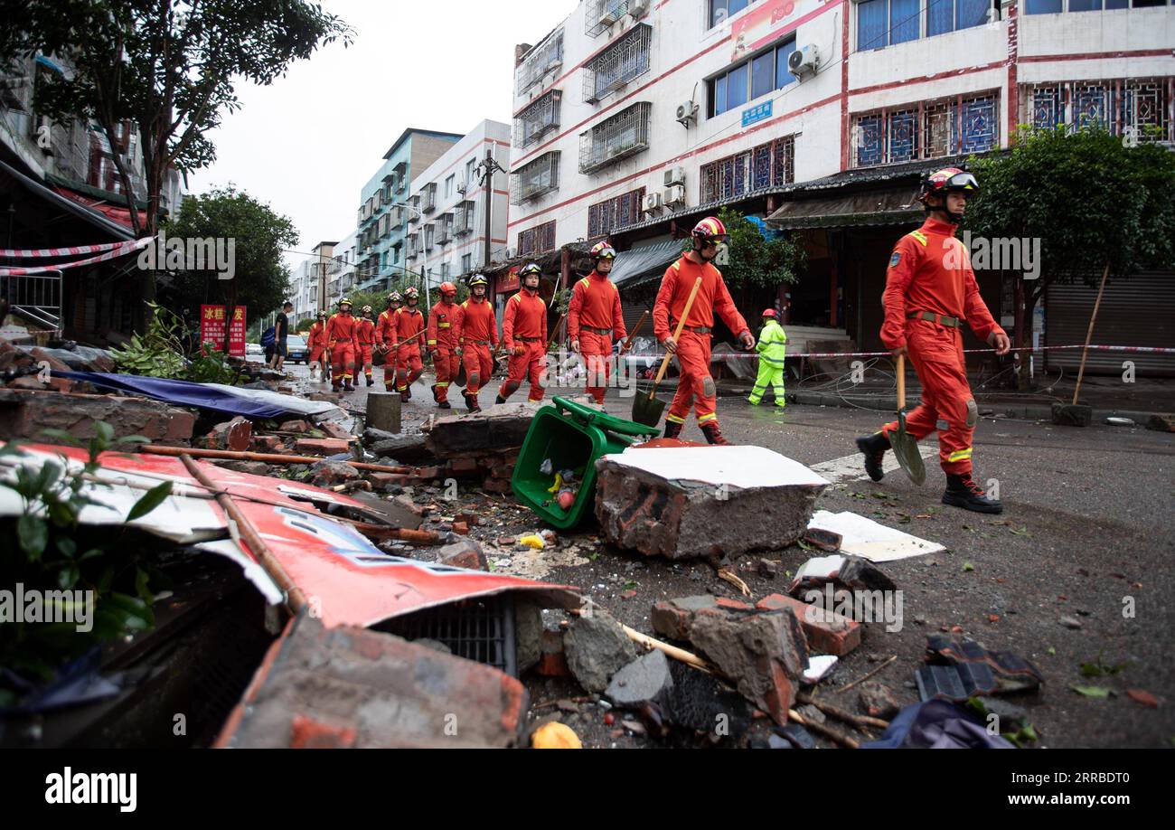 210916 -- LUZHOU, Sept. 16, 2021 -- Rescue workers walk in Fuji Township of Luxian County, southwest China s Sichuan Province, Sept. 16, 2021. Three people were confirmed dead and 60 others were sent to hospital after a 6.0-magnitude earthquake jolted Luxian County. Among those hospitalized, three were seriously injured, according to the city s emergency management bureau.  CHINA-SICHUAN-LUZHOU-EARTHQUAKE-DISASTER RELIEF CN JiangxHongjing PUBLICATIONxNOTxINxCHN Stock Photo