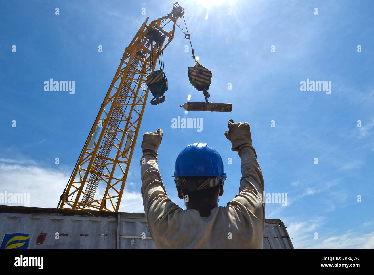 210926 -- MUNSHIGANJ, Sept. 26, 2021 -- A worker works at a construction site of Padma Multipurpose Bridge Project in Munshiganj on the outskirts of Dhaka, Bangladesh, on Sept. 12, 2021. For Bangladeshis, a dream is coming true. The history of crossing the mighty Padma river between dozens of districts in southern Bangladesh and the capital of Dhaka only by ferries or boats is all set to end. The mega multipurpose road-rail bridge dubbed the Dream Padma Bridge of Bangladesh is nearing completion after workers overcame tons of hurdles, including challenges brought by the COVID-19 pandemic. The Stock Photo