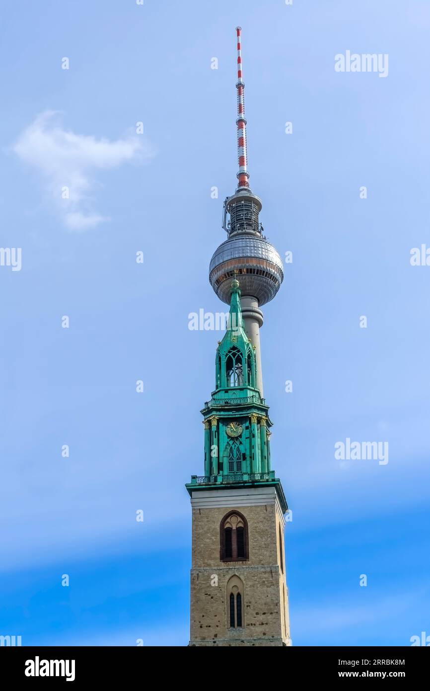 TV Tower Fernsehturm St Mary's Church Marienkirche Alexanderplatz Berlin Germany. Oldest church in Berlin. Tower constructed in 1960s by East German C Stock Photo