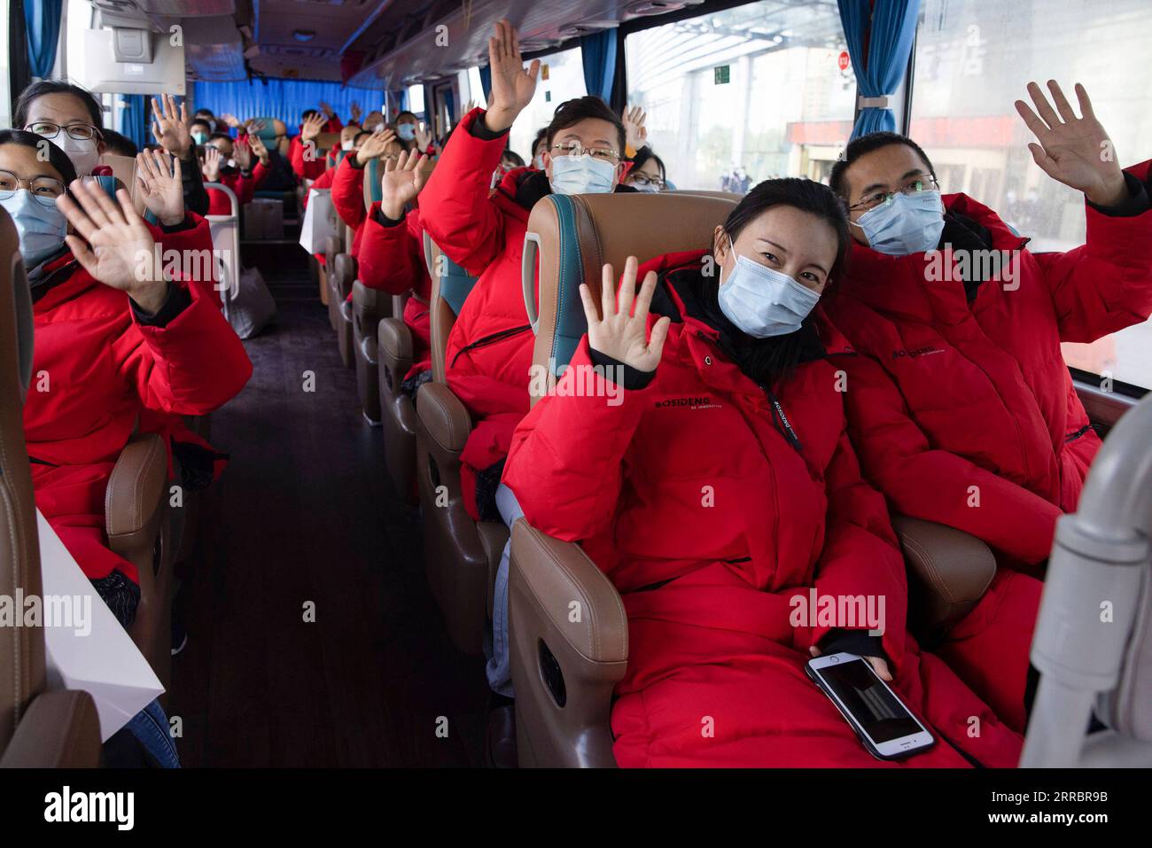 211004 -- HARBIN, Oct. 4, 2021 -- Medical workers from Hebei Province wave goodbye on a returning bus in Harbin, northeast China s Heilongjiang Province, Oct. 4, 2021. A total of 266 medical workers from Hebei and Jilin provinces who came to aid Harbin in nucleic acid testing left the city on Monday after finishing their work.  CHINA-HEILONGJIANG-HARBIN-COVID-19-AID TEAM-RETURN CN ZhangxTao PUBLICATIONxNOTxINxCHN Stock Photo