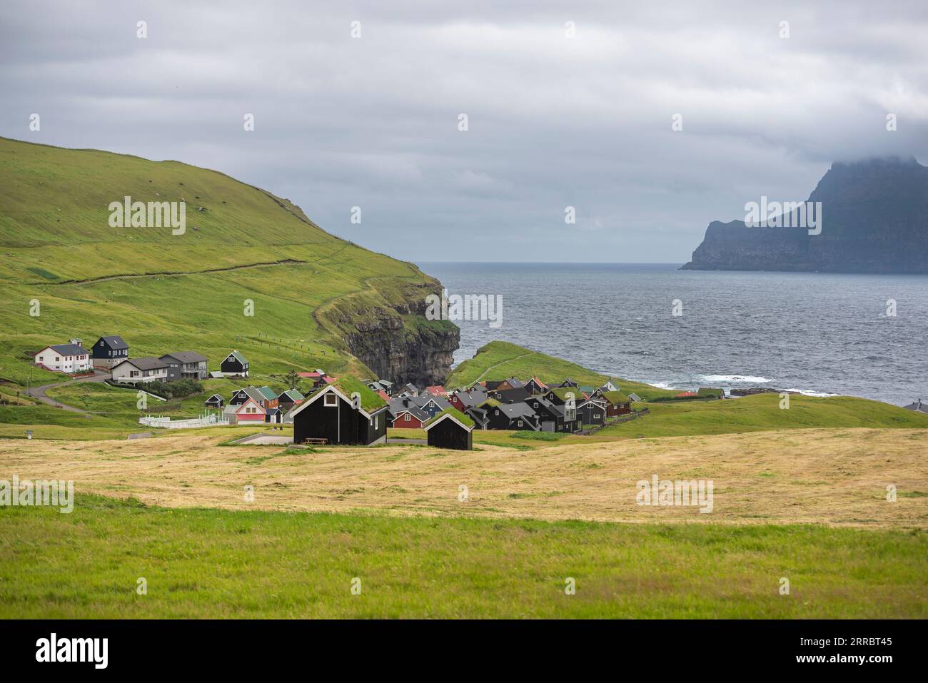 The small village of Gjogv crowds the sea on the northeast corner of