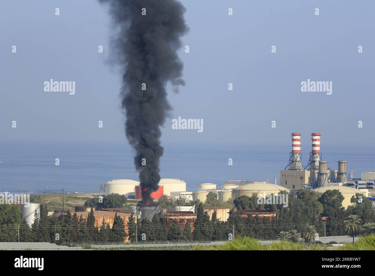 211011 -- BEIRUT, Oct. 11, 2021 -- Photo taken on Oct. 11, 2021 shows a fire burning at the al-Zahrani oil facility in southern Lebanon. A huge fire broke out on Monday at a fuel storage tank of an oil facility in southern Lebanon, causing the loss of about 250,000 liters of fuel, the National News Agency NNA reported. Lebanese Energy Minister Walid Fayyad announced that the fire at the al-Zahrani oil facility was caused by a technical error in the transport of fuel. Photo by /Xinhua LEBANON-OIL FACILITY-FIRE AlixHashisho PUBLICATIONxNOTxINxCHN Stock Photo