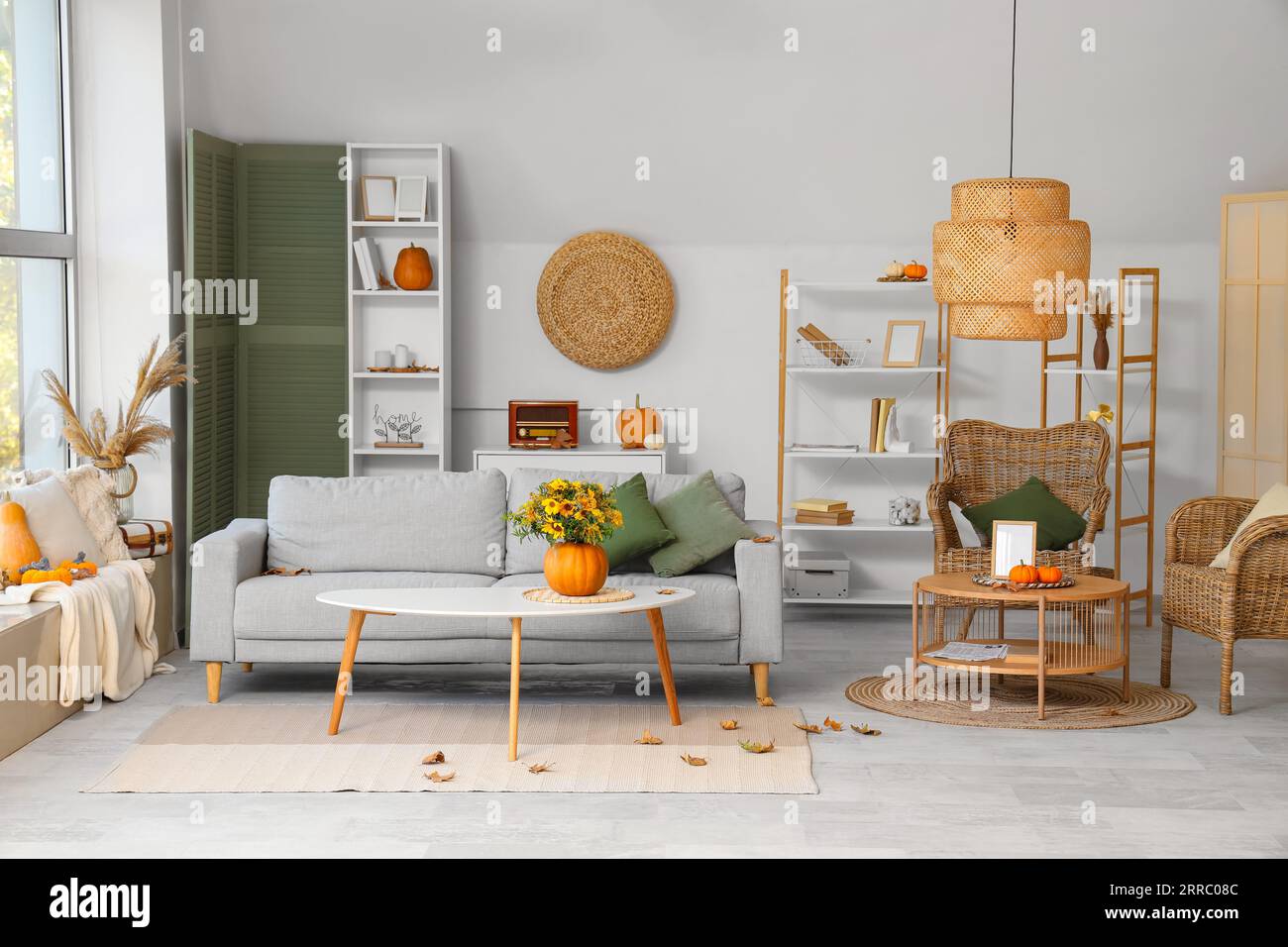 Interior of living room with pumpkins, sofa and armchairs Stock Photo ...