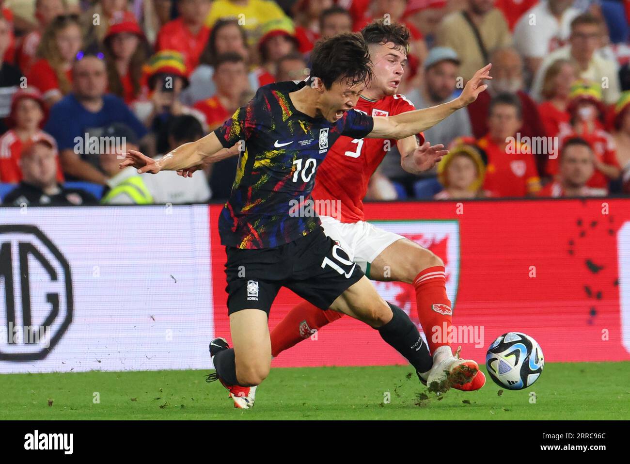 Cardiff, UK. 7th Sep, 2023. Neco Williams of Wales and Lee Jaesung of South Korea battle for possession during the International Friendly football match between Wales and South Korea at Cardiff City Stadium in Cardiff, Wales. (James Whitehead/SPP) Credit: SPP Sport Press Photo. /Alamy Live News Stock Photo