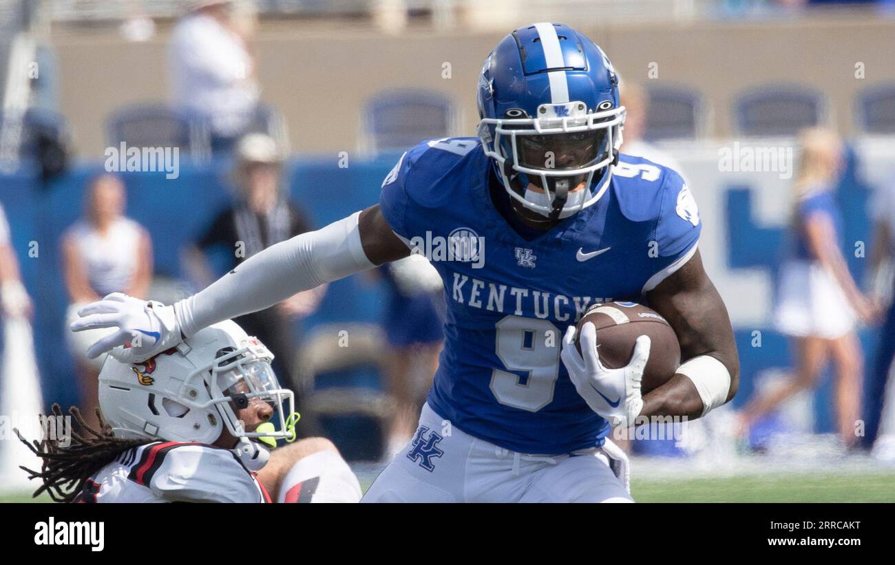 Kentucky wide receiver Tayvion Robinson (9) pushes off a defender