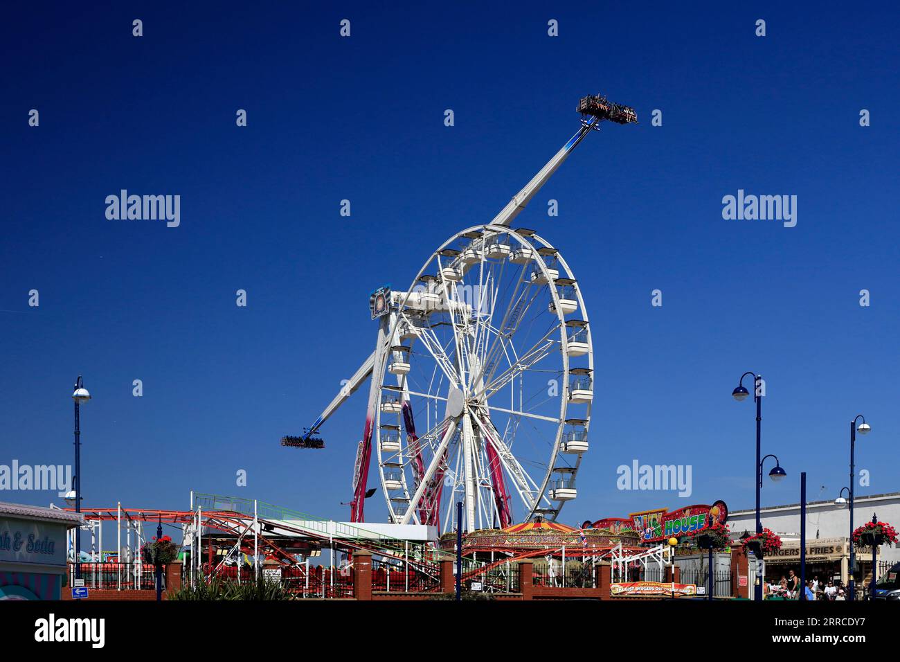 Aerospace ride and the Ferris wheel, Fun Fair, Barry Island Pleasure Park. Sept 2023 Stock Photo