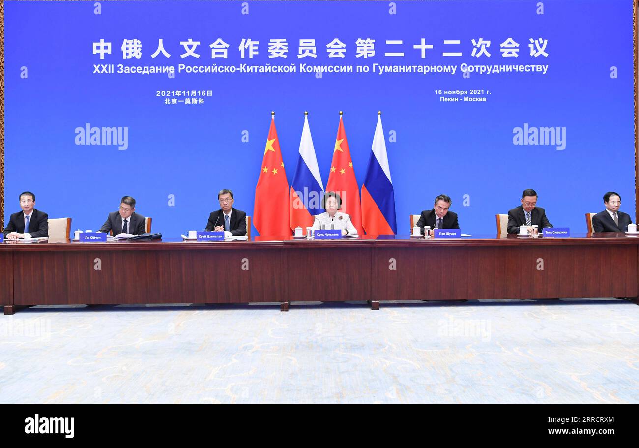 211116 -- BEIJING, Nov. 16, 2021 -- Chinese Vice Premier Sun Chunlan and Russian Deputy Prime Minister Tatyana Golikova attend the 22nd session of the China-Russia Committee on Humanities Cooperation via video link, Nov. 16, 2021.  CHINA-SUN CHUNLAN-RUSSIA-MEETING CN YinxBogu PUBLICATIONxNOTxINxCHN Stock Photo