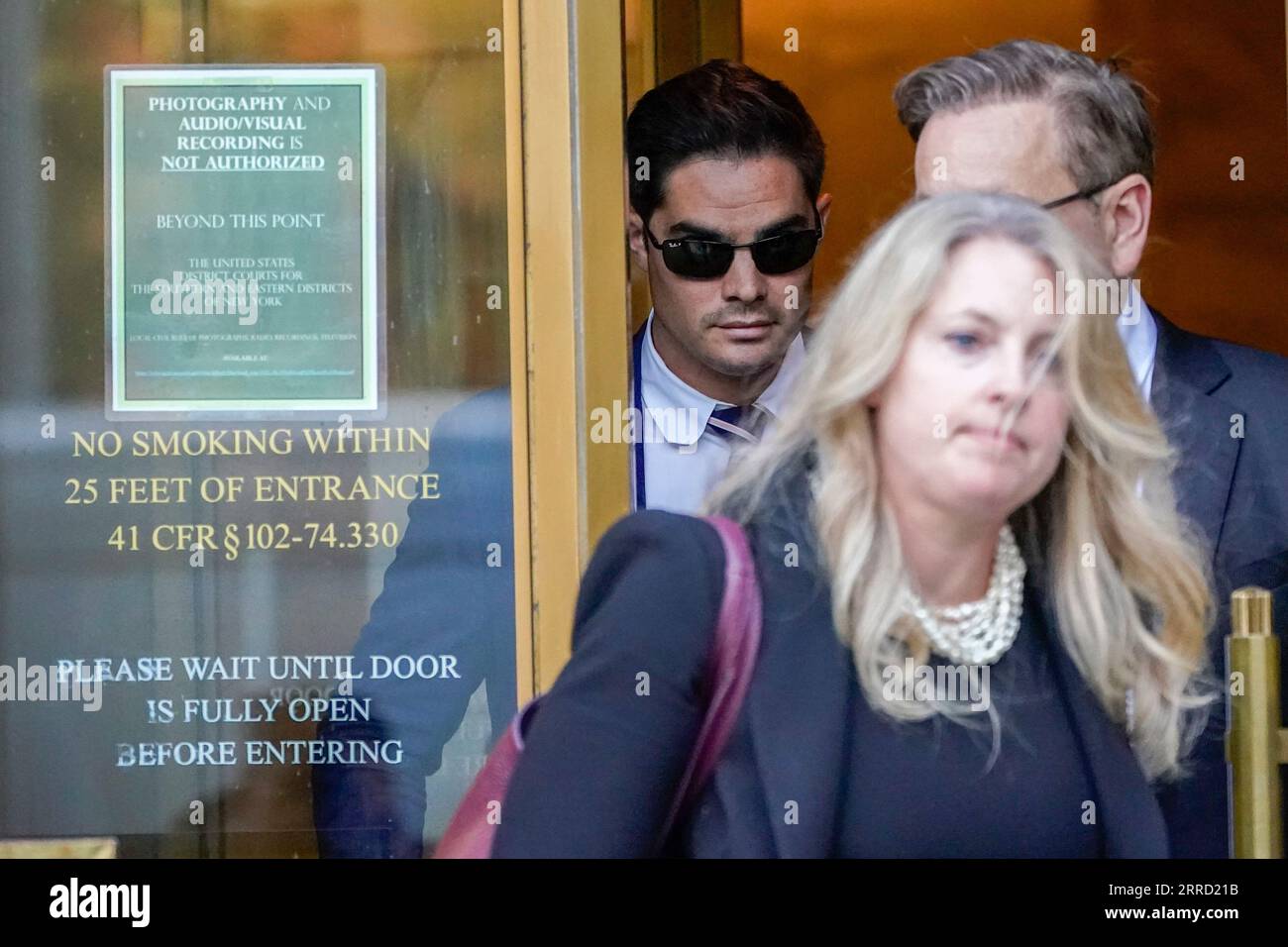 Ryan Salame, left, leaves Federal court with his attorneys, Thursday, Sept.  7, 2023, in New York. Salame, the former top executive at the failed FTX  cryptocurrency exchange pleaded guilty Thursday to making