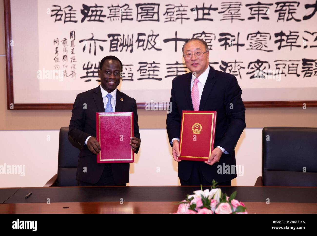 211130 -- NEW YORK, Nov. 30, 2021 -- Zhang Jun R, China s permanent  representative to the United Nations, and Kennedy Godfrey Gastorn,  secretary-general of the Asian-African Legal Consultative Organization  AALCO, pose