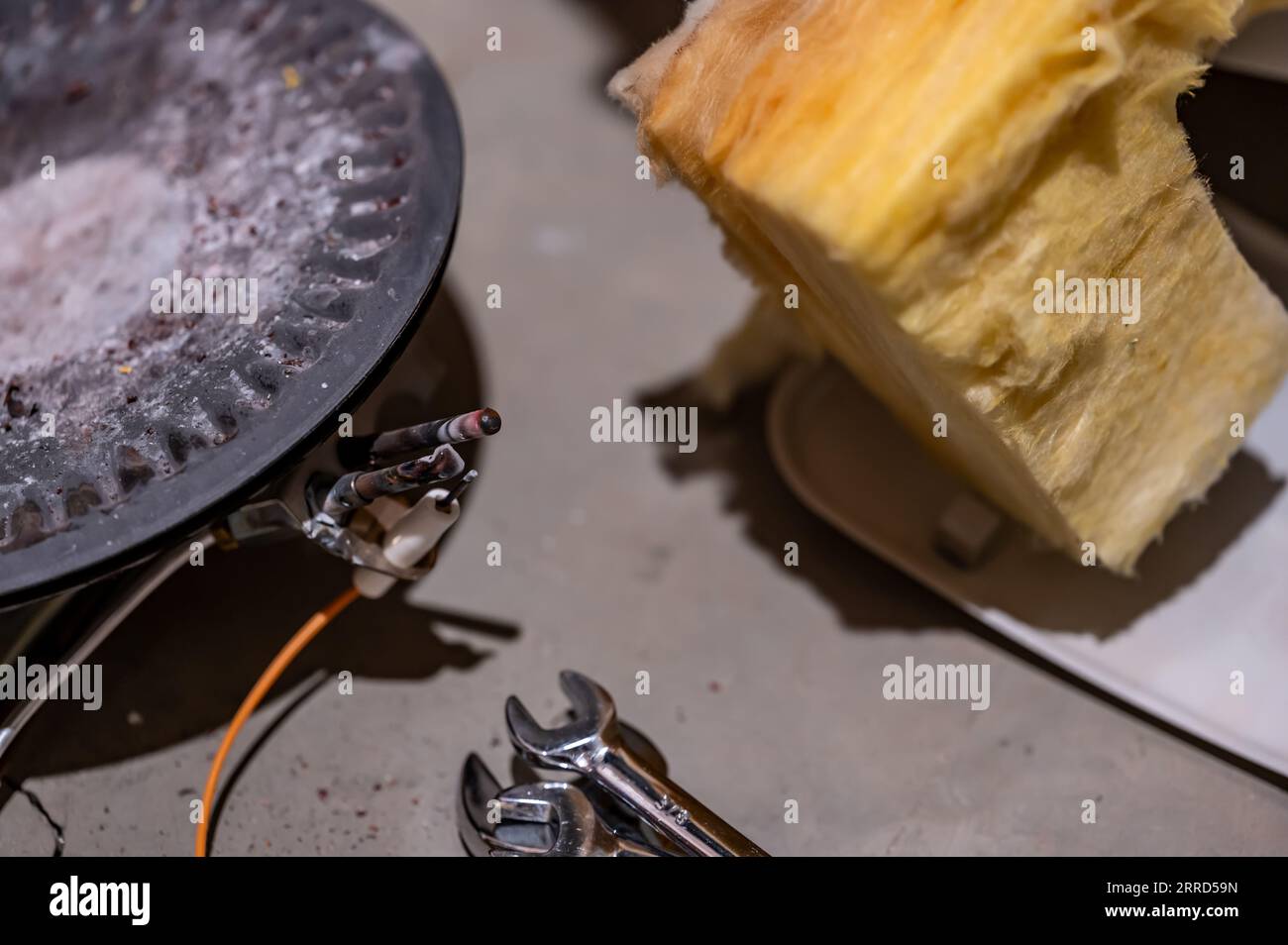 Hot water heater burner pan and element being replaced Stock Photo Alamy
