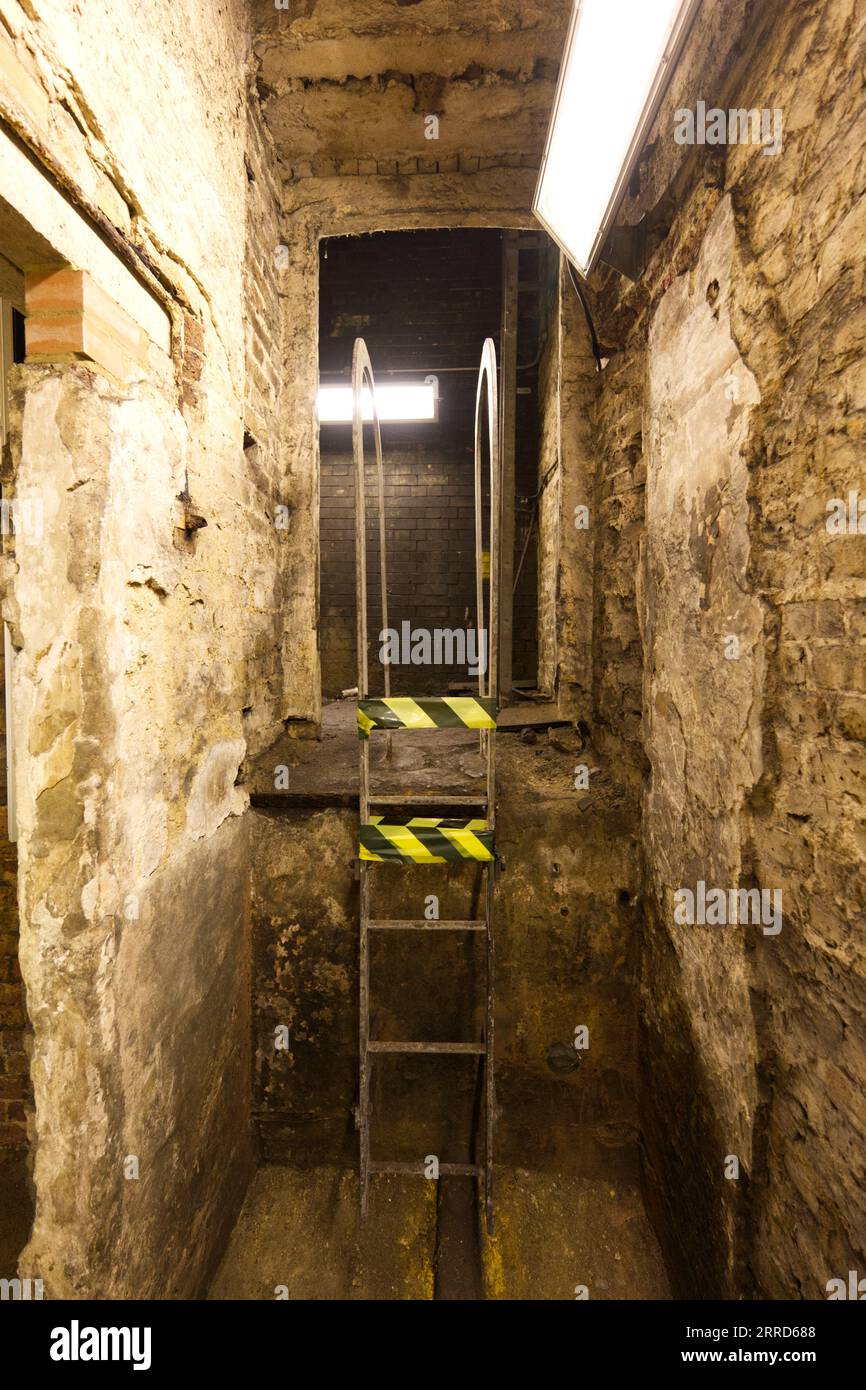 taped off service steps in a service tunnel - Hidden London: Baker Street Stock Photo