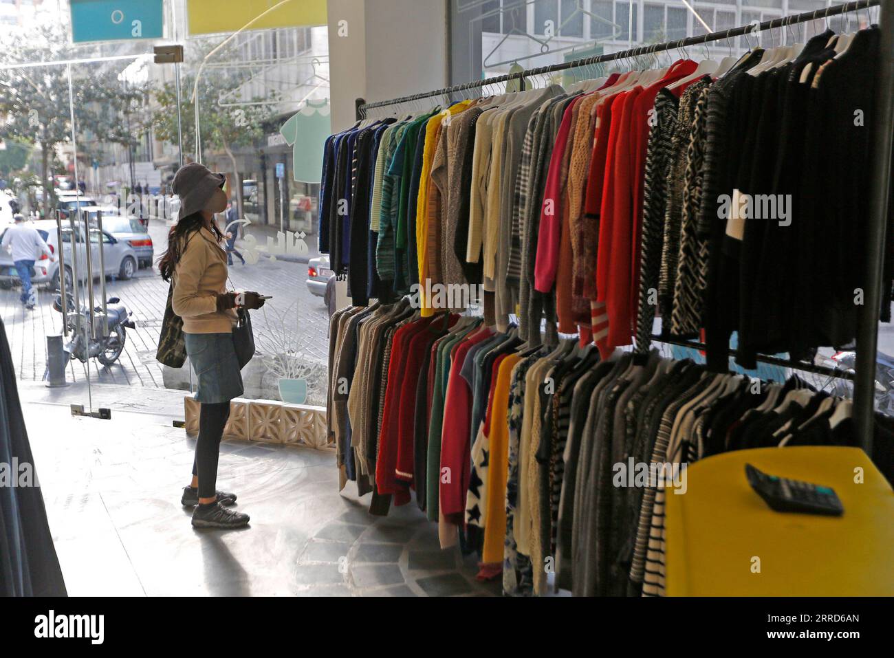 211205 BEIRUT, Dec. 5, 2021 A customer looks at clothes at a