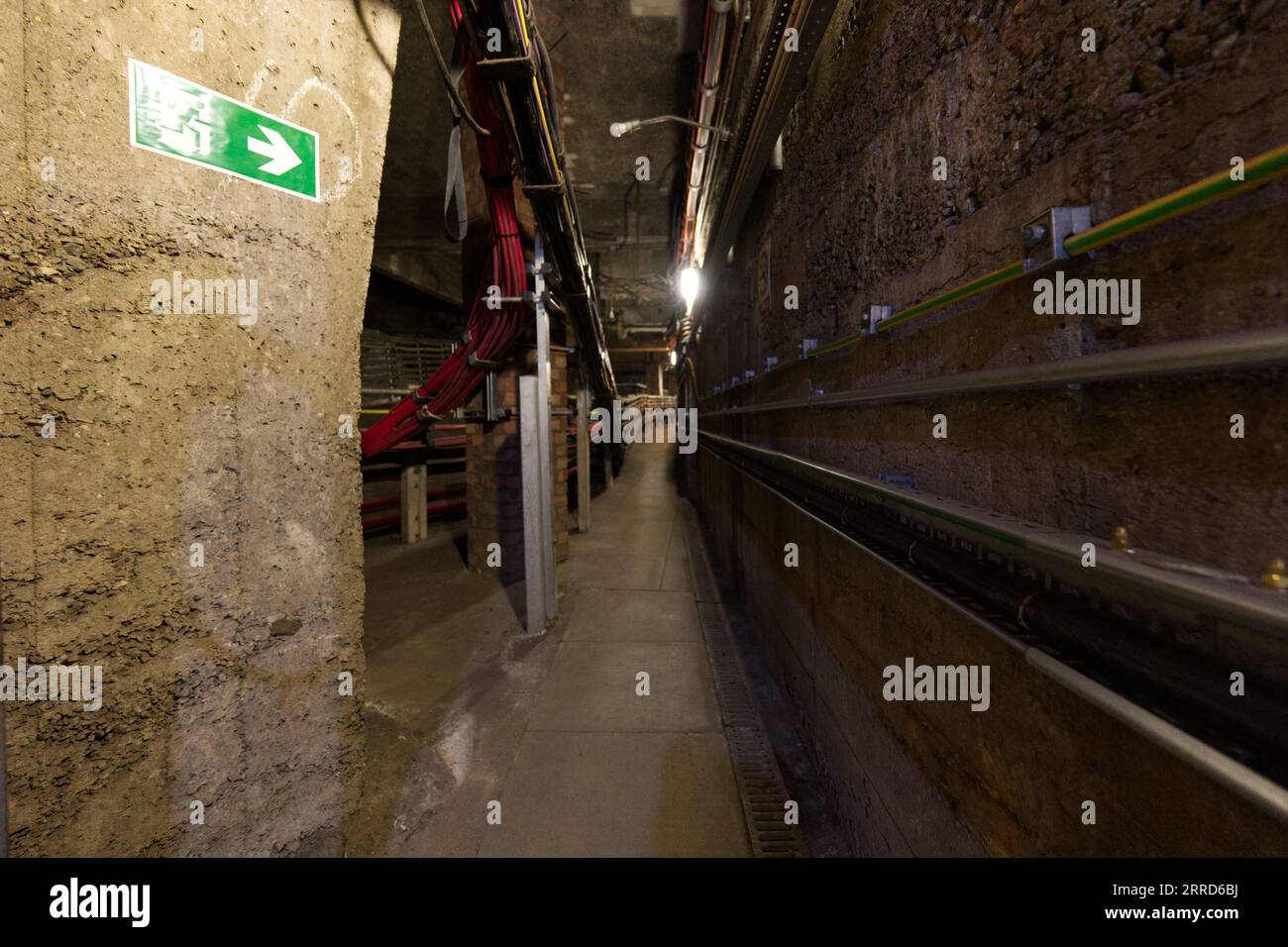 A service tunnel with electrical cabling - Hidden London: Baker Street Stock Photo