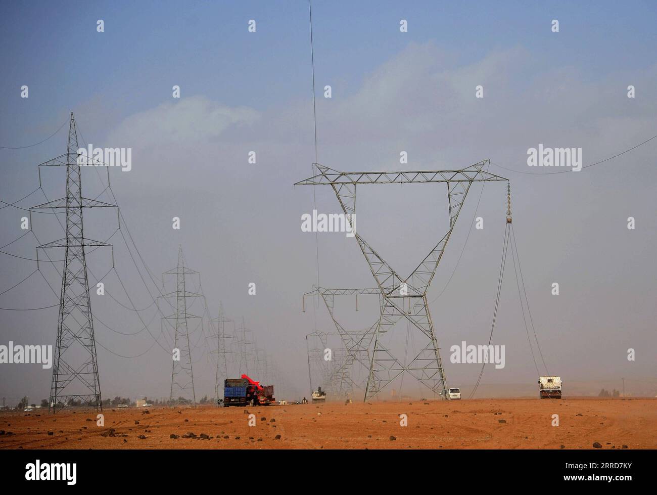 211208 DARAA SYRIA Dec. 8 2021 Workers fix high voltage