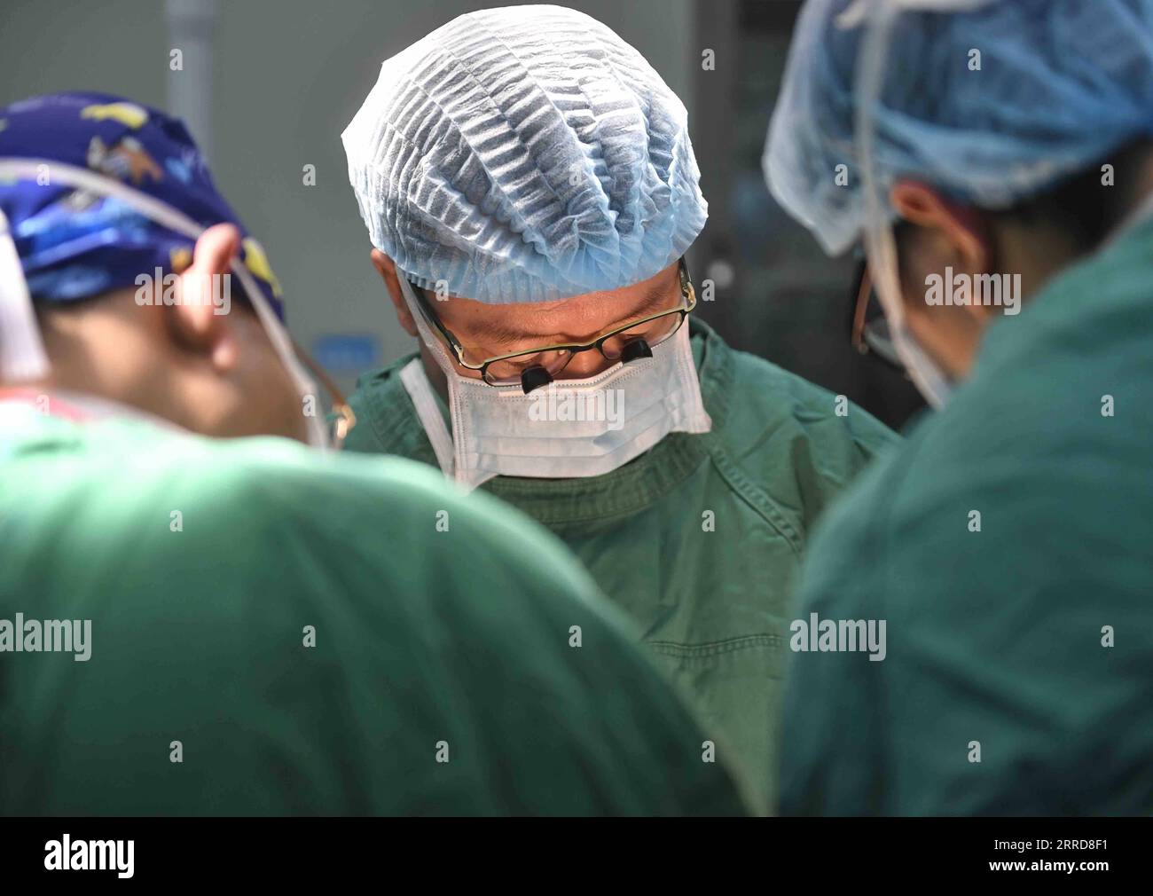 211210 -- CHENGDU, Dec. 10, 2021 -- Wang Wentao C uses the technology of extracorporeal hepatectomy plus liver autotransplantation in the treatment of a late-stage hydatid disease patient at a hospital in Tibetan Autonomous Prefecture of Garze, southwest China s Sichuan Province, Jan. 16, 2020. Wang Wentao, deputy director of the liver surgery department at West China Hospital of Sichuan University, started his work on the prevention and control of hydatid disease in Tibetan Autonomous Prefecture of Garze in 2006 when he learned that some local people suffer from hydatid disease during one of Stock Photo