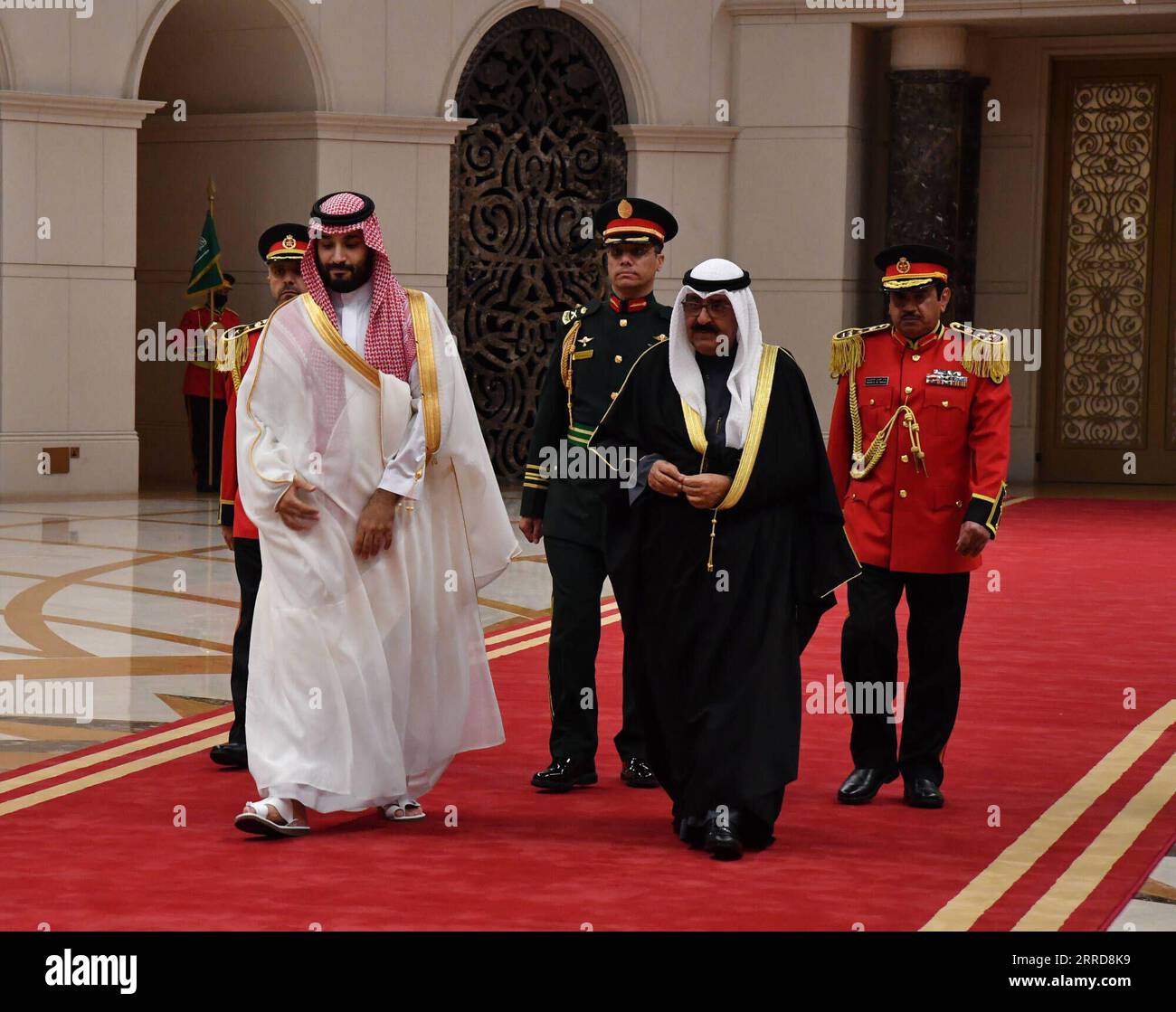 211210 -- FARWANIYA GOVERNORATE, Dec. 10, 2021  -- Kuwaiti Crown Prince Sheikh Mishal Al-Ahmad Al-Jaber Al-Sabah R, Front welcomes Saudi Arabia s Crown Prince Mohammed bin Salman bin Abdulaziz Al Saud L, Front at an airport in Farwaniya Governorate, Kuwait, on Dec. 10, 2021. Kuwaiti Crown Prince Sheikh Mishal Al-Ahmad Al-Jaber Al-Sabah and visiting Saudi Arabia s Crown Prince Mohammed bin Salman bin Abdulaziz Al Saud discussed on Friday ways of strengthening relations and boosting cooperation, the Kuwait News Agency KUNA said.  KUWAIT-FARWANIYA GOVERNORATE-SAUDI CROWN PRINCE-VISIT Xinhua PUBLI Stock Photo
