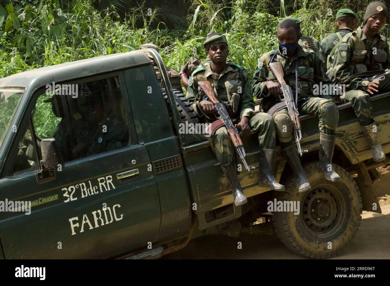 211212 -- , Dec. 12, 2021 -- Soldiers are seen on a military vehicle during a joint military operation against armed forces in Beni territory, northeastern Democratic Republic of the Congo, Dec. 11, 2021. The Armed Forces of the Democratic Republic of the Congo FARDC and Uganda People s Defense Force UPDF on Saturday released the first assessment of their joint military operations against rebels of the Allied Democratic Forces ADF, conducted since Nov. 30 in Beni territory, northeastern DRC. TO GO WITH: DR Congo, Uganda declare calm situation in northeastern DRC following assessment of joint m Stock Photo