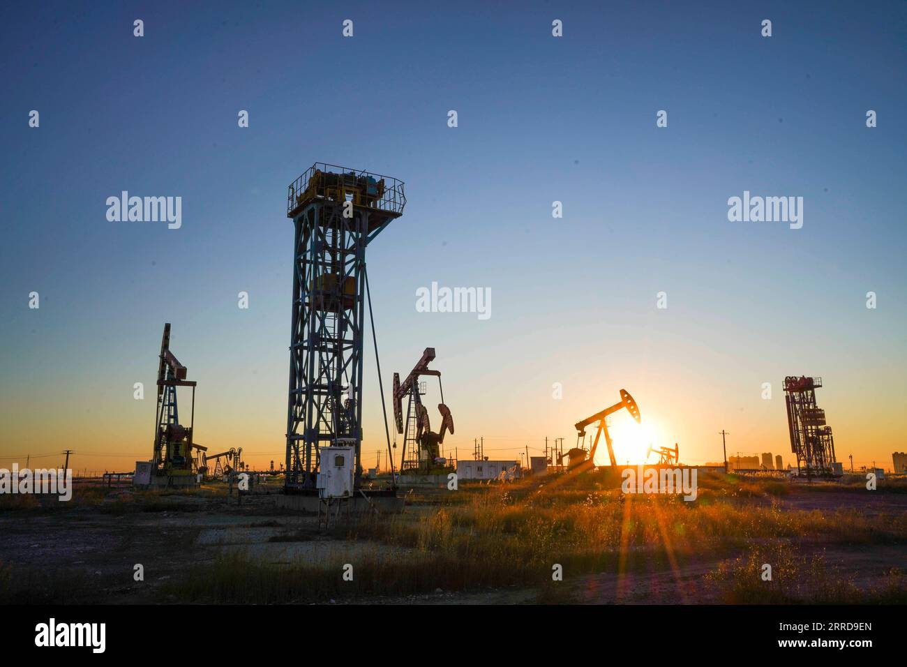 211212 -- TANGSHAN, Dec. 12, 2021 -- Photo taken on Dec. 12, 2021 shows the morning view of Jidong Oilfield in north China s Hebei Province. Since entering winter, workers at Jidong Oilfield have overcome the unfavorable factors of winter production and strengthened daily inspection to ensure the completion of annual production targets. Photo by /Xinhua CHINA-HEBEI-JIDONG OILFIELD CN LiuxMancang PUBLICATIONxNOTxINxCHN Stock Photo