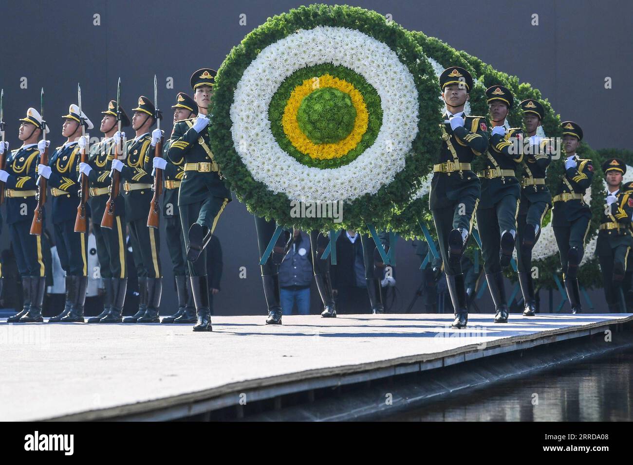 211213 -- NANJING, Dec. 13, 2021 -- China holds its eighth national memorial ceremony for the Nanjing Massacre victims at the Memorial Hall of the Victims in Nanjing Massacre by Japanese Invaders in Nanjing, capital of east China s Jiangsu Province, Dec. 13, 2021.  CHINA-JIANGSU-NANJING MASSACRE VICTIMS-NATIONAL MEMORIAL CEREMONY CN LixBo PUBLICATIONxNOTxINxCHN Stock Photo