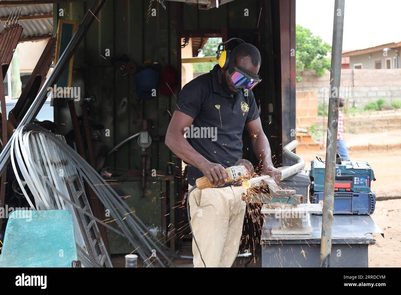 211218 ACCRA, Dec. 18, 2021 Ibrahim Sumaila works on a component
