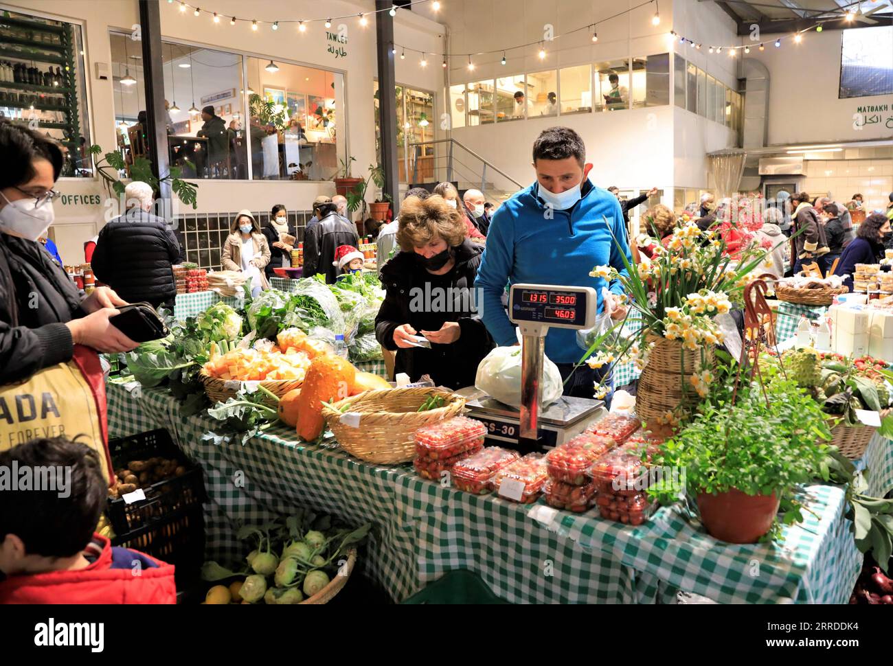 211219 -- BEIRUT, Dec. 19, 2021 -- People visit Souk El Tayeb farmers market in Beirut, Lebanon, on Dec. 18, 2021. Souk El Tayeb farmers market opens on Wednesday and Saturday, selling goods including vegetables, fruits, flowers, Lebanese kebbe, sweets and wines.  LEBANON-BEIRUT-SOUK EL TAYEB-FARMERS MARKET LiuxZongya PUBLICATIONxNOTxINxCHN Stock Photo