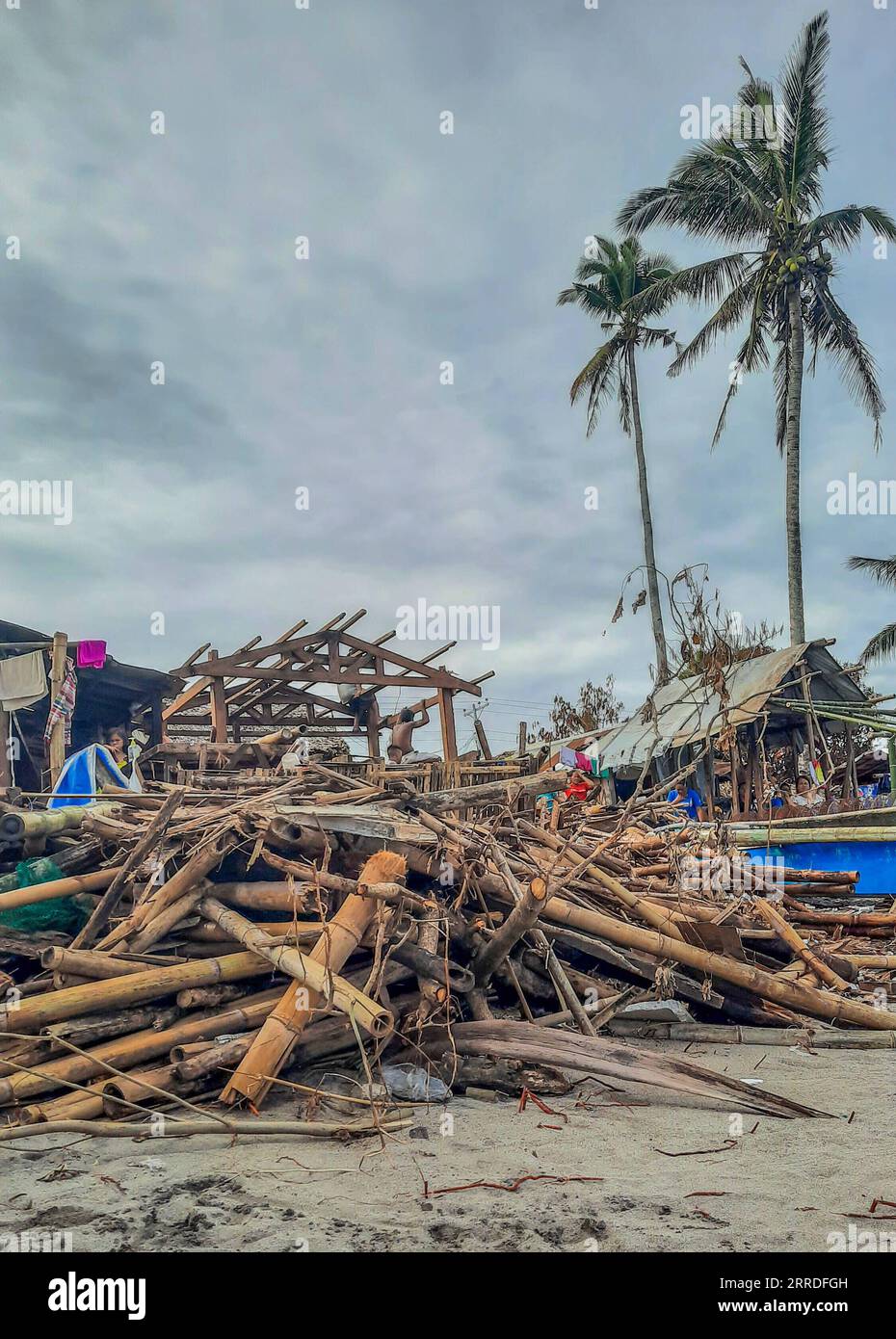 211222 -- LEYTE PROVINCE, Dec. 22, 2021 -- Photo shows a fishing community damaged by Typhoon Rai along a shoreline in Leyte Province, the Philippines, Dec. 22, 2021. The National Disaster Risk Reduction and Management Council NDRRMC reported that 156 people died from the typhoon, while the Philippine National Police reported at least 375 deaths. Many more are missing or injured. On Thursday afternoon, Typhoon Rai first swept across Siargao Island, off the eastern coast on Mindanao island in the southern Philippines. It lashed the Southeast Asian country for three days, causing flooding and la Stock Photo