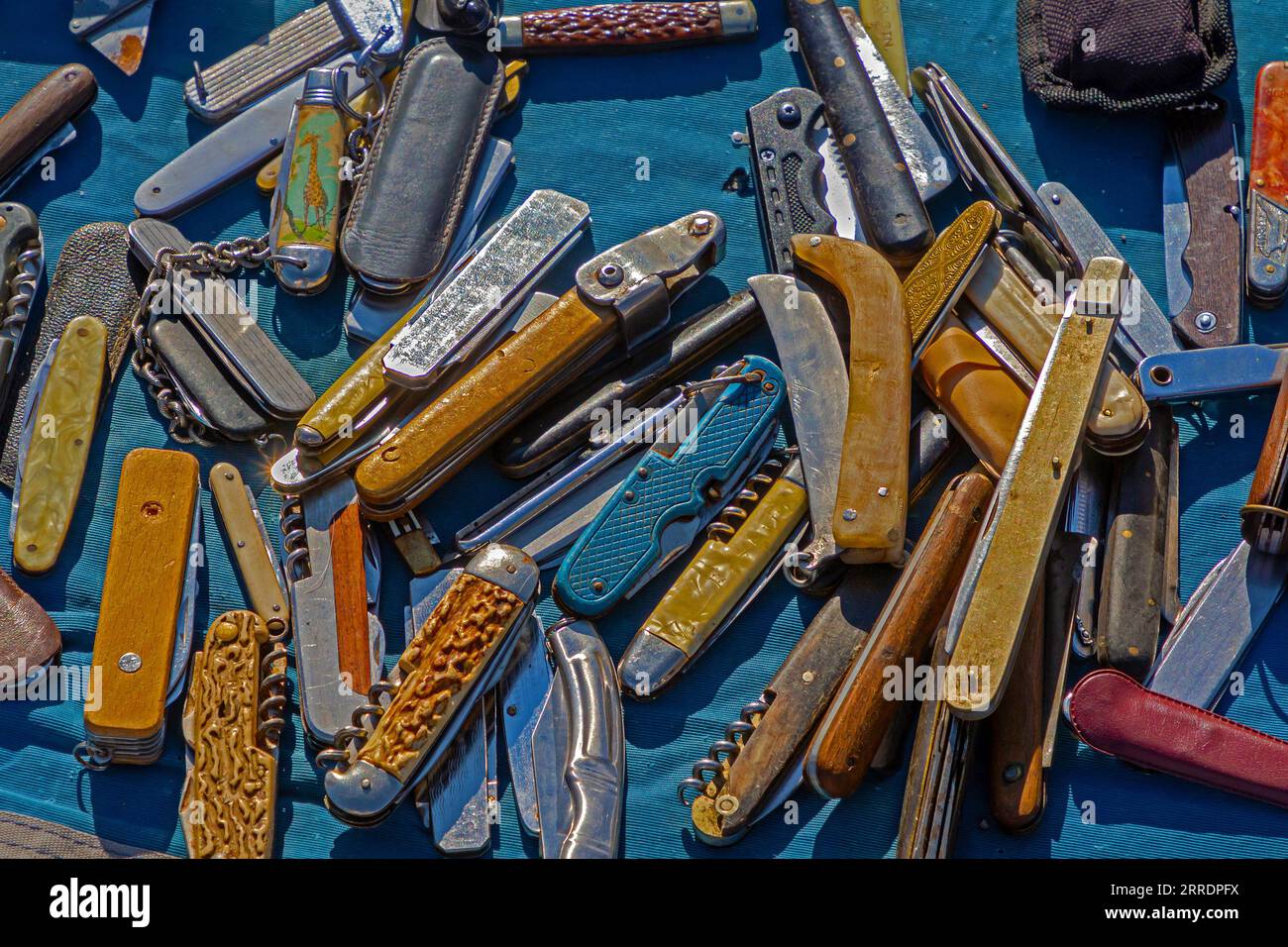 Pile of folding pocket knives sold outside on a market Stock Photo Alamy