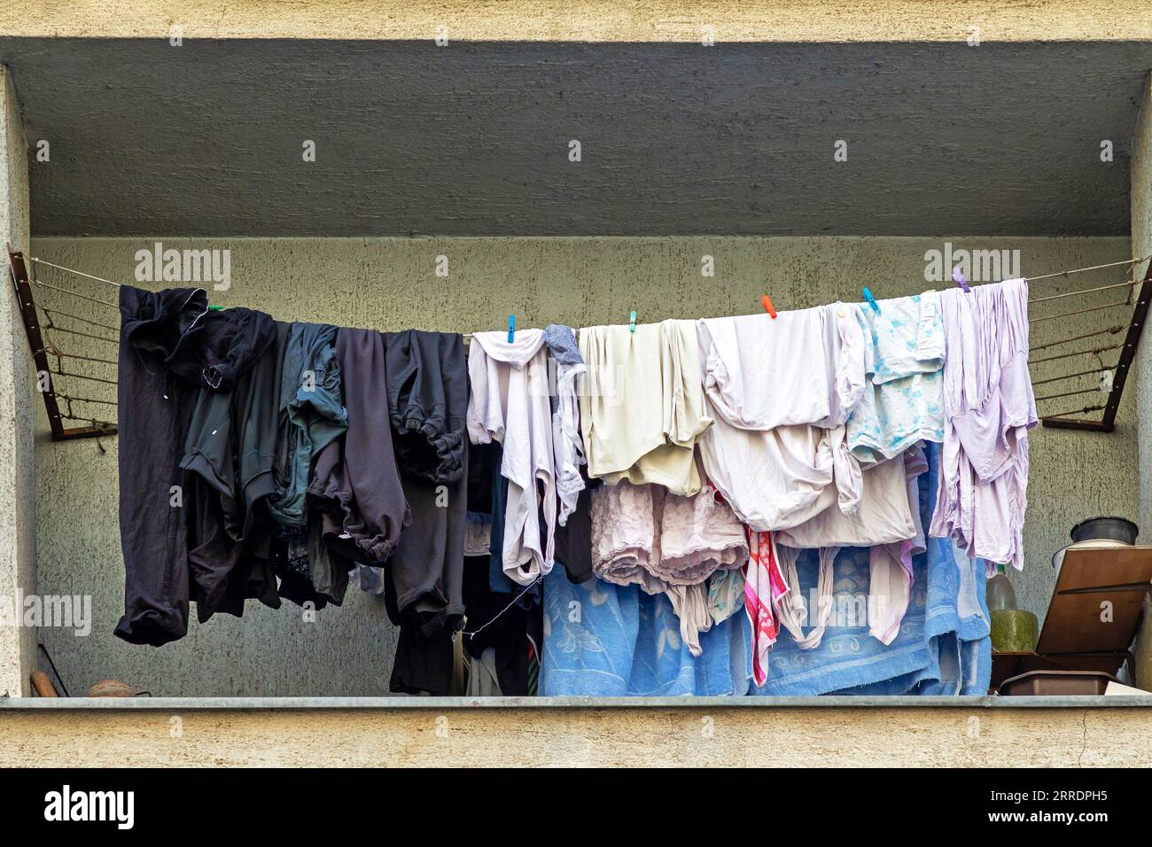 Wet laundry clothes drying outside on a balcony Stock Photo Alamy