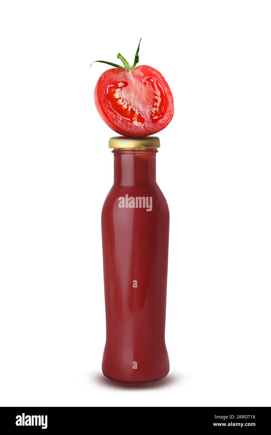 Organic ketchup in glass bottle and cut tomato isolated on white Stock Photo Alamy