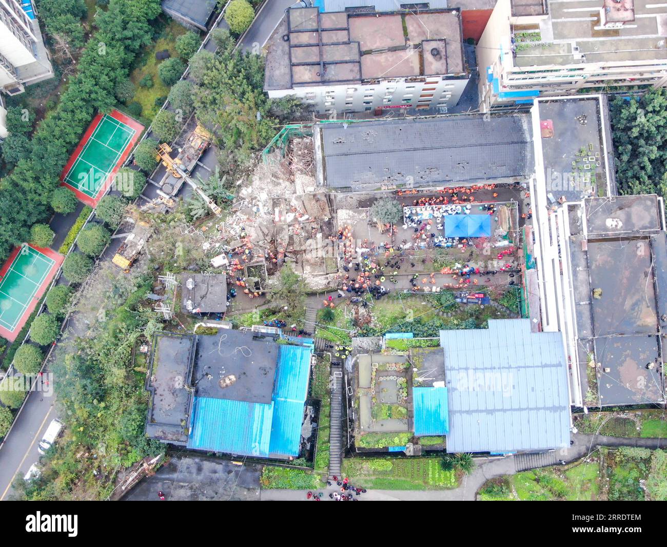 220107 -- CHONGQING, Jan. 7, 2022 -- Aerial photo taken on Jan. 7, 2022 shows the site of a blast in Wulong District, southwest China s Chongqing. More than 20 people were believed to have been trapped after a blast rocked a canteen of a subdistrict office in Wulong District, southwest China s Chongqing Municipality, on Friday noon. The accident took place at 12:10 p.m. due to suspected gas leakage which triggered the explosion and caused the collapse, said the municipal publicity department. According to witnesses, people were having lunch in the canteen when the blast took place. A number of Stock Photo