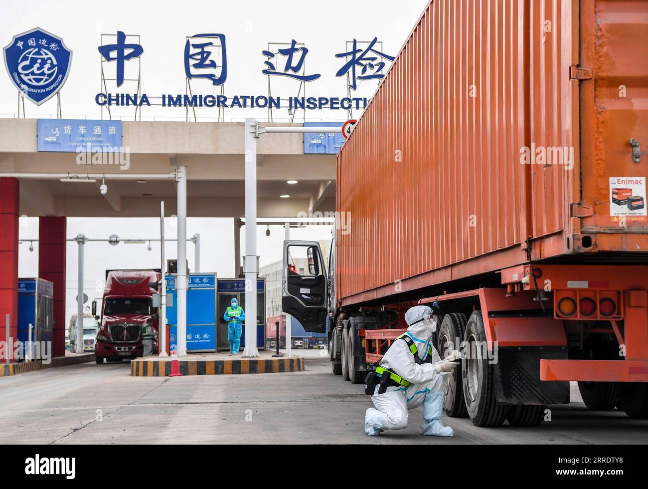 220108 -- DONGXING, Jan. 8, 2022 -- A police officer of immigration inspection checkpoint checks a truck at Dongxing port in Dongxing, south China s Guangxi Zhuang Autonomous Region, Jan. 8, 2022. The immigration inspection checkpoint in Dongxing has resumed customs clearance Saturday with strict epidemic control and prevention measures after the suspension since Dec. 21, 2021 due to the COVID-19 resurgence.  CHINA-GUANGXI-DONGXING-IMMIGRATION INSPECTION-RESUMPTION CN CaoxYiming PUBLICATIONxNOTxINxCHN Stock Photo