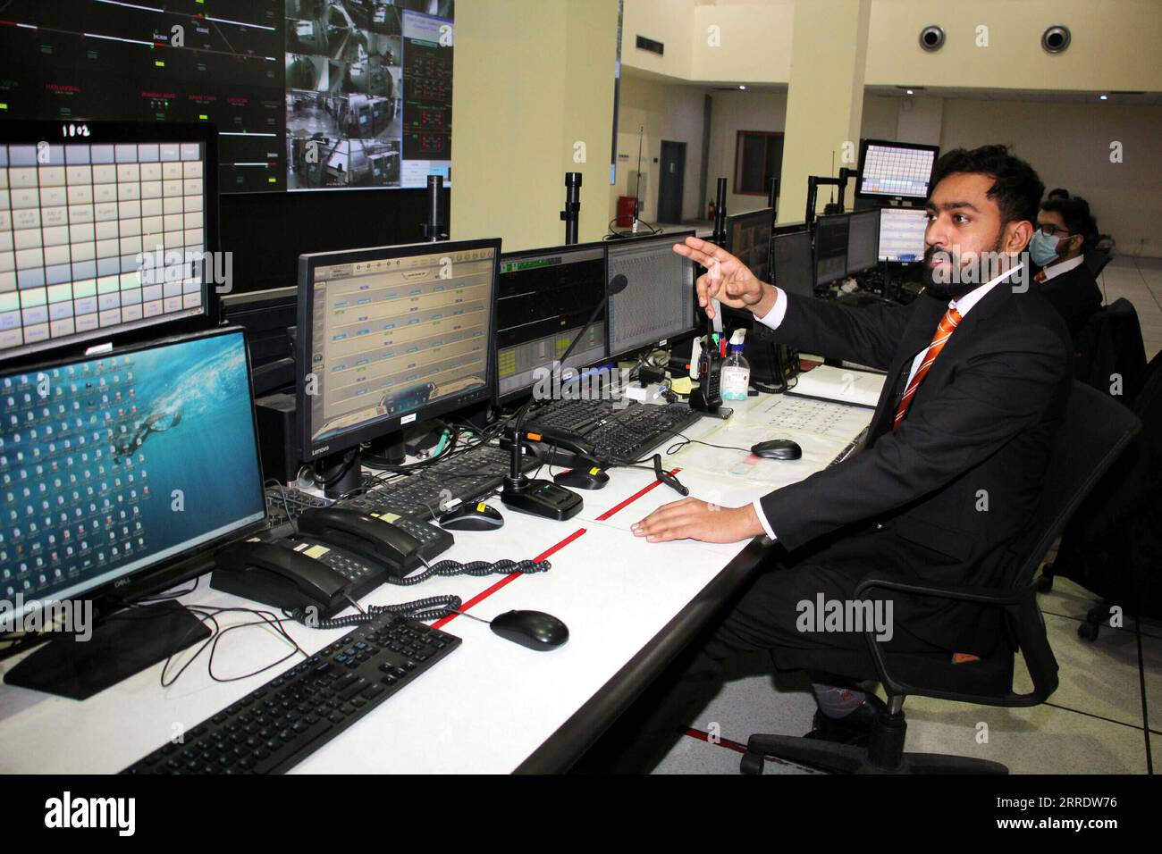 220109 -- LAHORE, Jan. 9, 2022 -- Mohammad Nauman works at the control room of the terminal station of the Orange Line in Lahore, Pakistan, Dec. 29, 2021. Officially open to traffic on Oct. 25, 2020, the eco-friendly Orange Line metro train is an early project under the China-Pakistan Economic Corridor CPEC, a flagship project of the China-proposed Belt and Road Initiative. TO GO WITH Feature: Lahore Orange Line, epitome of China-Pakistan friendship Photo by /Xinhua PAKISTAN-LAHORE-B&R-CPEC-ORANGE LINE METRO TRAIN JamilxAhmed PUBLICATIONxNOTxINxCHN Stock Photo