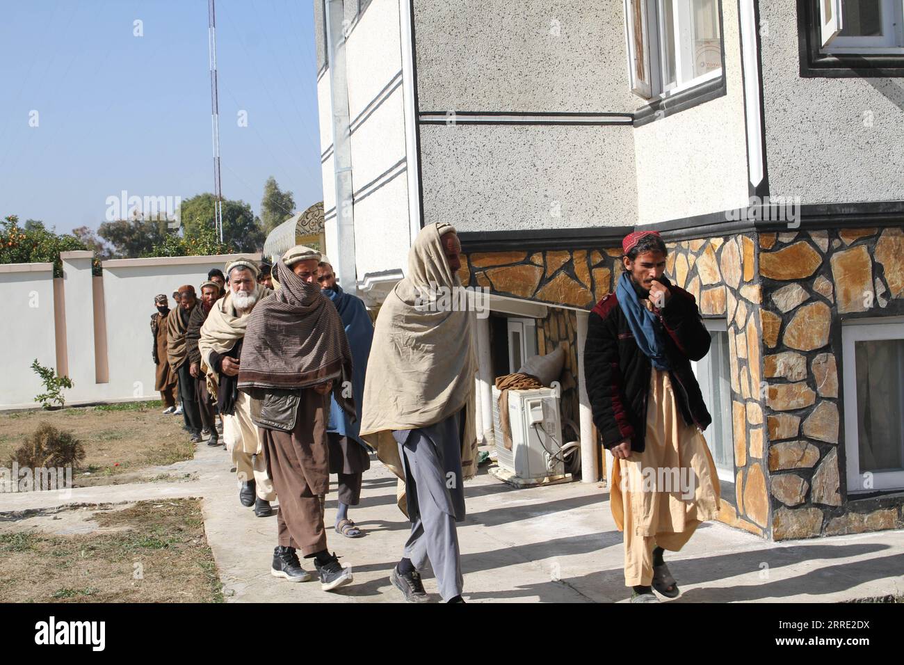 220121 -- JALALABAD, Jan. 21, 2022 -- Islamic State IS militants attend a  surrender ceremony in Jalalabad, capital of Nangarhar Province, Afghanistan,  Jan. 20, 2022. Seventy militants of IS terror group surrendered