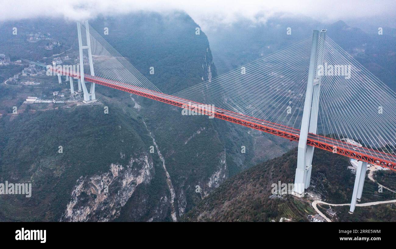 220130 -- LIUPANSHUI, Jan. 30, 2022 -- Aerial photo taken on Jan. 29, 2022 shows the Beipanjiang Bridge in southwest China s Guizhou Province. Sitting over 565.4 meters above a valley, the Beipanjiang Bridge has been certified as the world s highest bridge by the Guinness World Records. Spanning 1,341.4 meters, the bridge links Duge Township of Liupanshui in southwest China s Guizhou with Puli Township of Xuanwei in southwest China s Yunnan Province.  CHINA-GUIZHOU-LIUPANSHUI-BEIPANJIANG BRIDGE-MAINTENANCECN TaoxLiang PUBLICATIONxNOTxINxCHN Stock Photo