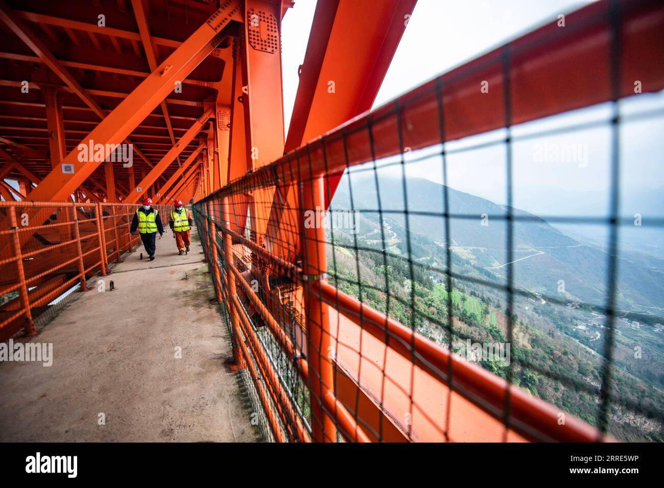 220130 -- LIUPANSHUI, Jan. 30, 2022 -- Maintenance workers examine the interior of the Beipanjiang Bridge in southwest China s Guizhou Province, Jan. 29, 2022. Sitting over 565.4 meters above a valley, the Beipanjiang Bridge has been certified as the world s highest bridge by the Guinness World Records. Spanning 1,341.4 meters, the bridge links Duge Township of Liupanshui in southwest China s Guizhou with Puli Township of Xuanwei in southwest China s Yunnan Province.  CHINA-GUIZHOU-LIUPANSHUI-BEIPANJIANG BRIDGE-MAINTENANCECN TaoxLiang PUBLICATIONxNOTxINxCHN Stock Photo
