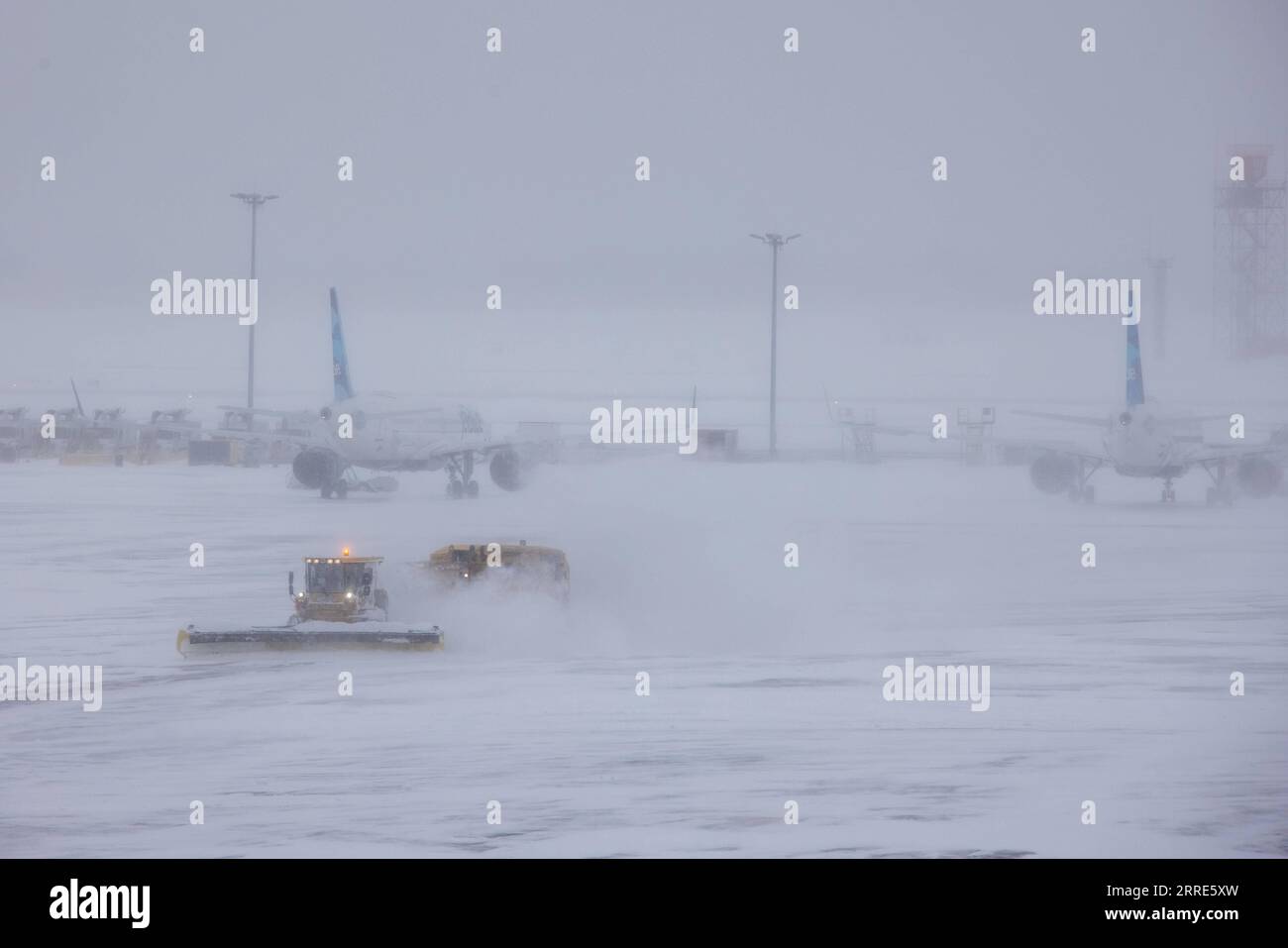 220130 -- NEW YORK, Jan. 30, 2022 -- Snow plows work at John F. Kennedy International Airport in New York, the United States, Jan. 29, 2022. Winter storm Kenan is bringing heavy snow and wind gusts to New York City and surrounding areas on Saturday. Snowfall at John F. Kennedy International Airport exceeded 5 inches in the last 12 hours, said a tweet from the National Weather Service at 9 a.m. on Saturday. As much as 460 flights from John F. Kennedy International Airport were canceled accounting for 80 percent of the total, according to travel information platform flightaware.com. Photo by /Xi Stock Photo