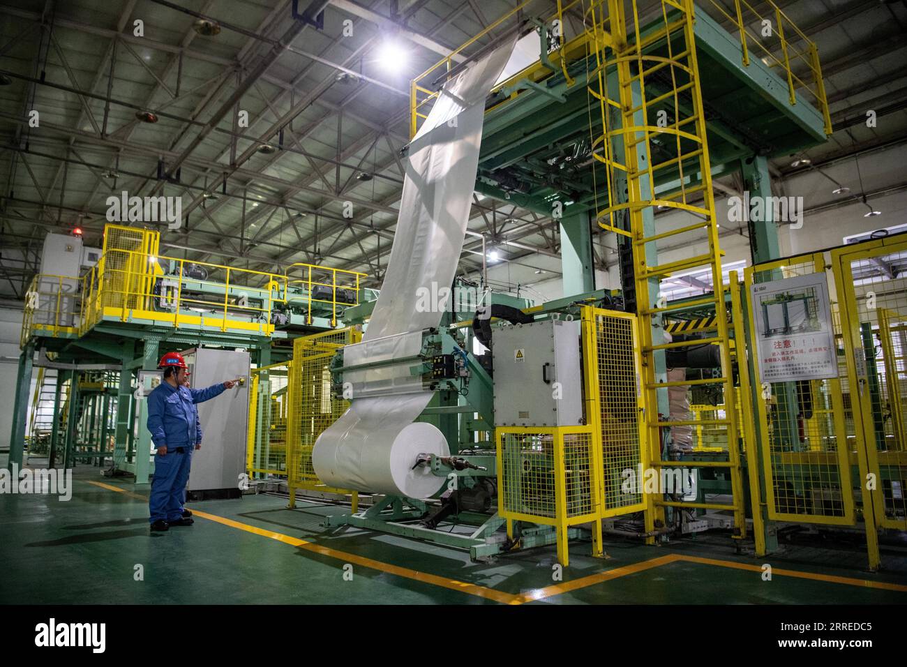 220220 -- CHONGQING, Feb. 20, 2022 -- A staff member checks the packaging of polyvinyl alcohol PVA products in Chongqing, southwest China, Feb. 12, 2022. A Yuxin ou Chongqing-Xinjiang-Europe China-Europe freight train carrying more than 1,100 tonnes of polyvinyl alcohol PVA and other fine chemical products left Guoyuan Port in Chongqing for Duisburg of Germany on Feb. 20.  CHINA-CHONGQING-CHINA-EUROPE FREIGHT TRAIN CN TangxYi PUBLICATIONxNOTxINxCHN Stock Photo