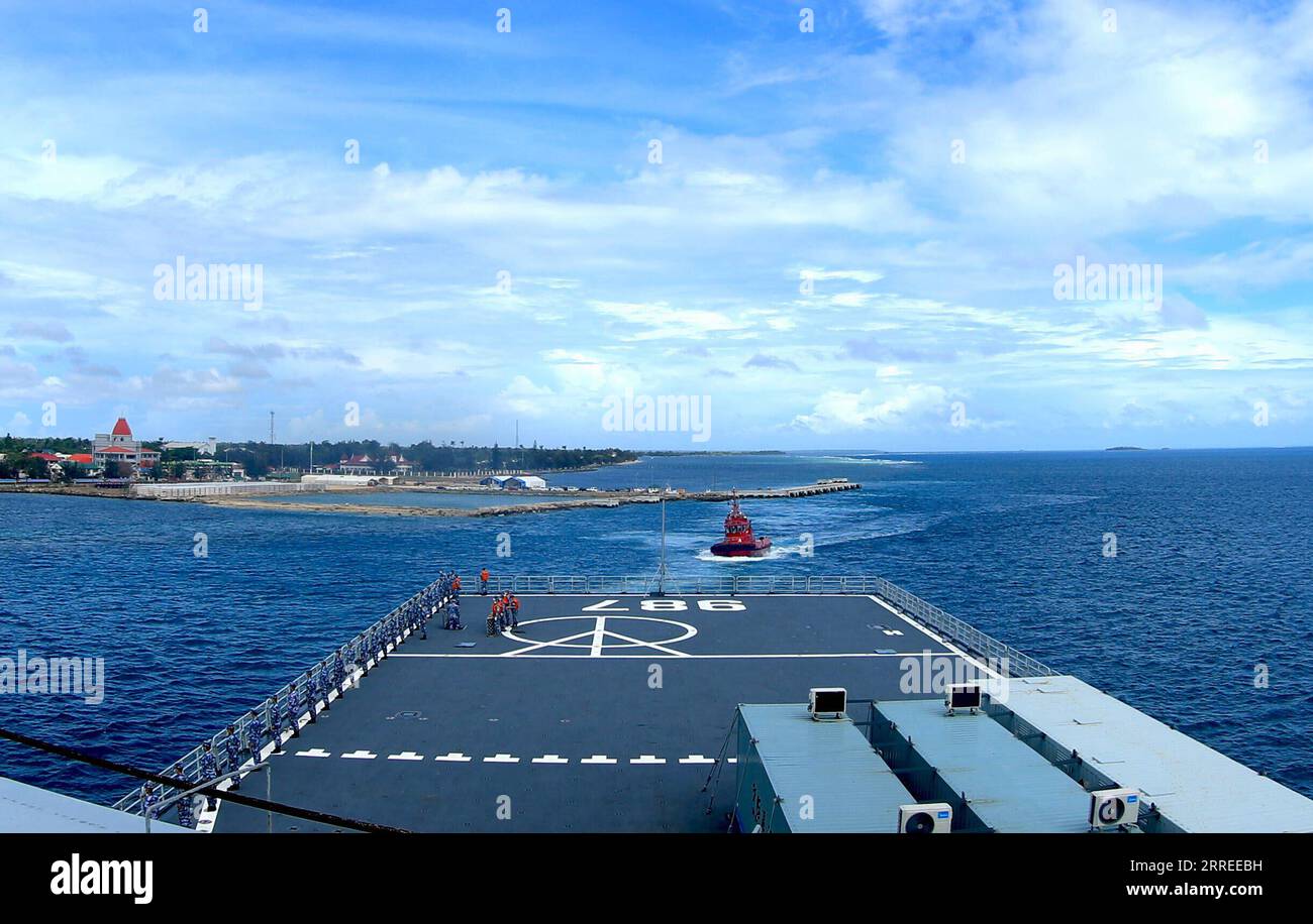 220224 -- NUKU ALOFA, Feb. 24, 2022 -- A flotilla of the Chinese People s Liberation Army PLA Navy departs from the port of Nuku alofa in Tonga, Feb. 23, 2022. The flotilla comprised of two ships of the PLA Navy departed the port of Nuku alofa on Wednesday after delivering China s disaster relief supplies to the South Pacific island nation of Tonga. Weighing approximately 1,400 tonnes, the latest supplies include mobile homes, tractors, electricity generators, water pumps, water purifiers, food and medical supplies. Photo by /Xinhua TONGA-CHINESE NAVY SHIPS-RELIEF SUPPLIES-DEPARTURE ZhouxYanch Stock Photo