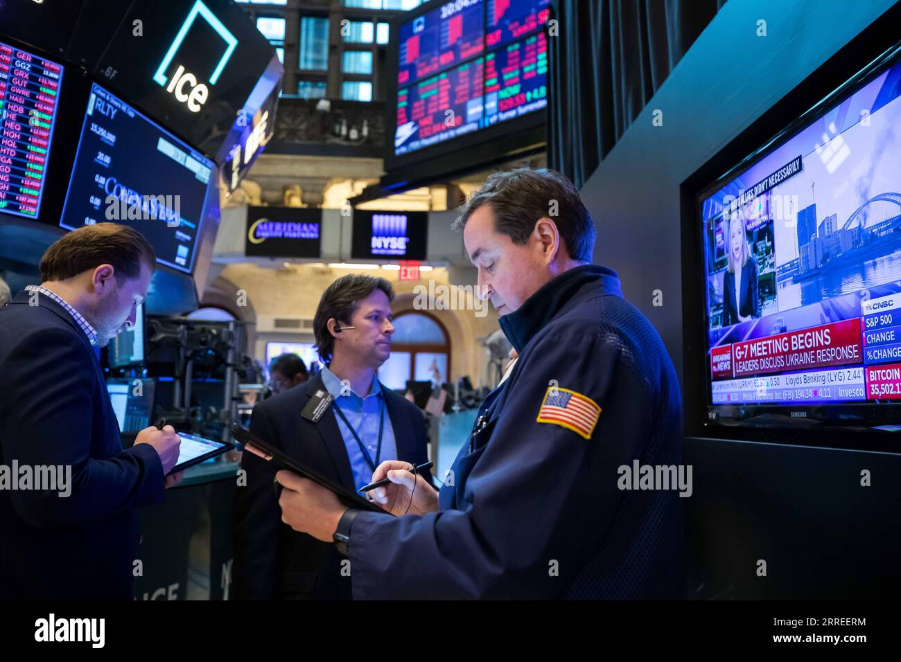 220224 -- NEW YORK, Feb. 24, 2022 -- Traders work at the New York Stock Exchange in New York, the United States, Feb. 24, 2022. U.S. stocks finished higher on Thursday, reversing the massive losses earlier in the session, as investors assessed the geopolitical tensions over Ukraine. The Dow Jones Industrial Average rose 92.07 points, or 0.28 percent, to 33,223.83. The S&P 500 climbed 63.20 points, or 1.50 percent, to 4,288.70. The Nasdaq Composite Index increased 436.09 points, or 3.34 percent, to 13,473.58. Earlier in the day, all the three major indexes fell sharply with the Dow dropping mor Stock Photo