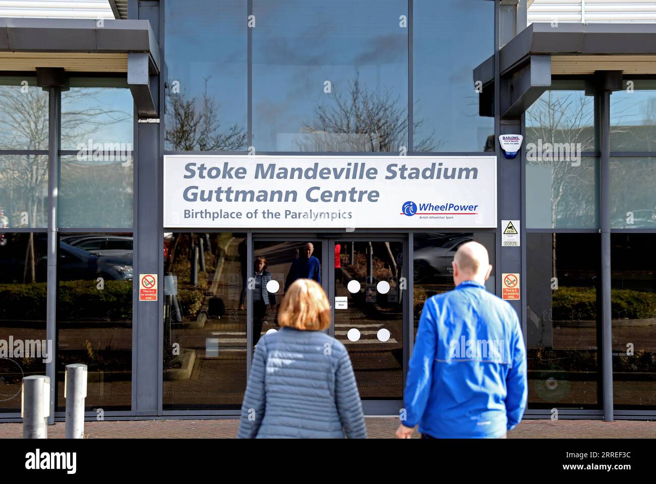 220225 -- STOCK MANDEVILLE, Feb. 25, 2022 -- People walk toward Stock Mandeville Stadium in Stoke Mandeville, Britain, Feb. 24, 2022. TO GO WITH Feature: An ongoing journey starts from Stoke Mandeville  SPBRITAIN-STOCK MANDEVILLE-PARALYMPIC GAMES-BIRTHPLACE LixYing PUBLICATIONxNOTxINxCHN Stock Photo