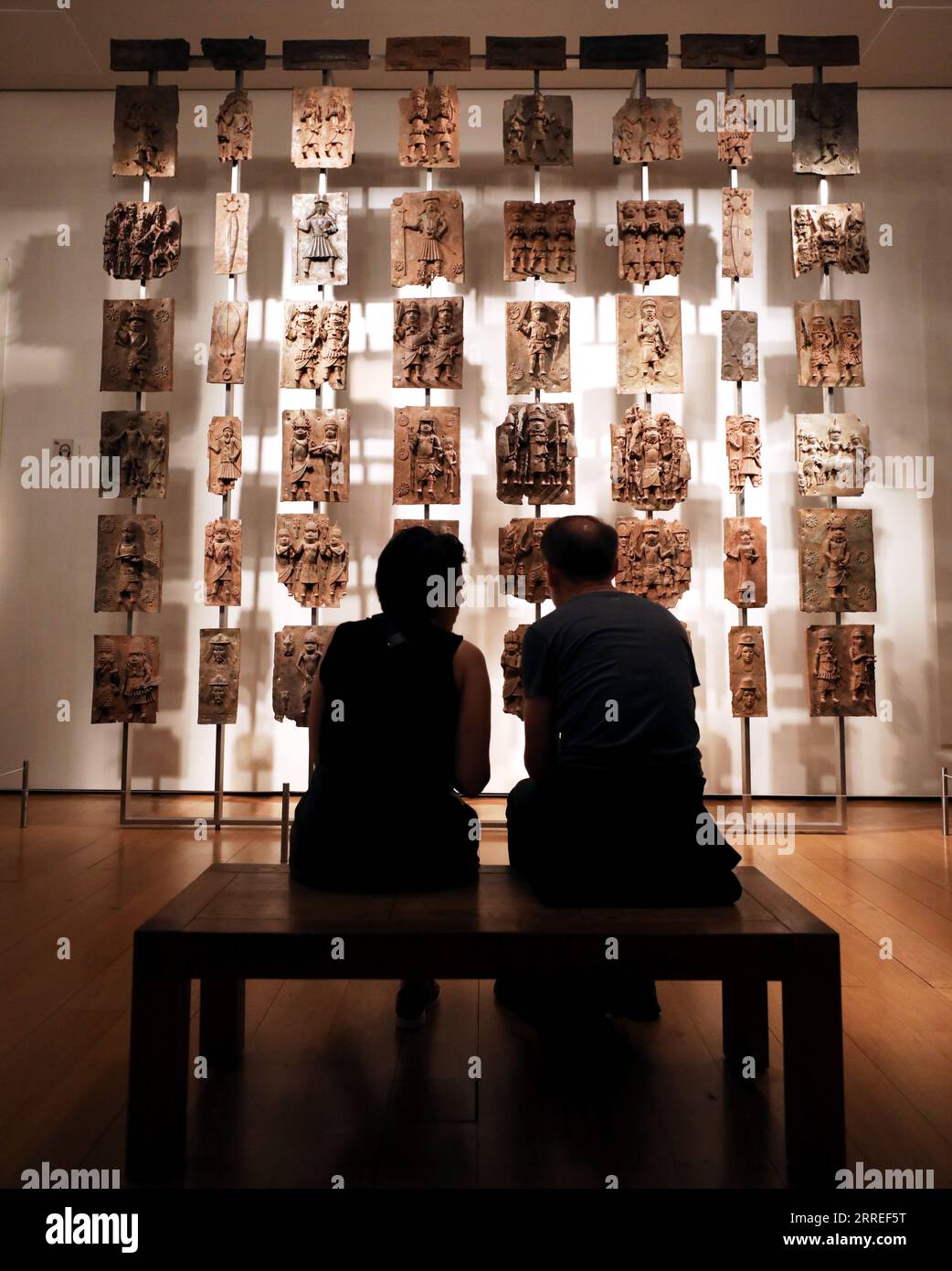 London, Britain. 7th Sep, 2023. People view the Benin Bronzes in the British Museum in London, Britain, Sept. 7, 2023. As the British Museum struggles to pick up the pieces amid the festering theft scandal, there have been renewed calls for the institution to return items it took from other countries.TO GO WITH 'Roundup: British Museum facing renewed calls to return cultural relics' Credit: Li Ying/Xinhua/Alamy Live News Stock Photo