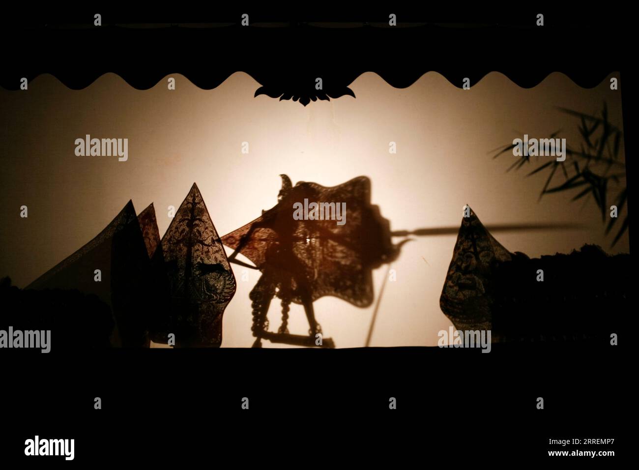 Silhouette of wayang kulit or shadow puppet Stock Photo