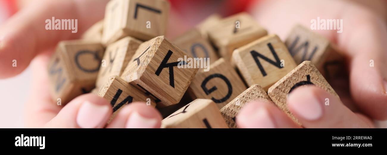Woman hands hold heap of wooden cubes with letters close up Stock Photo ...
